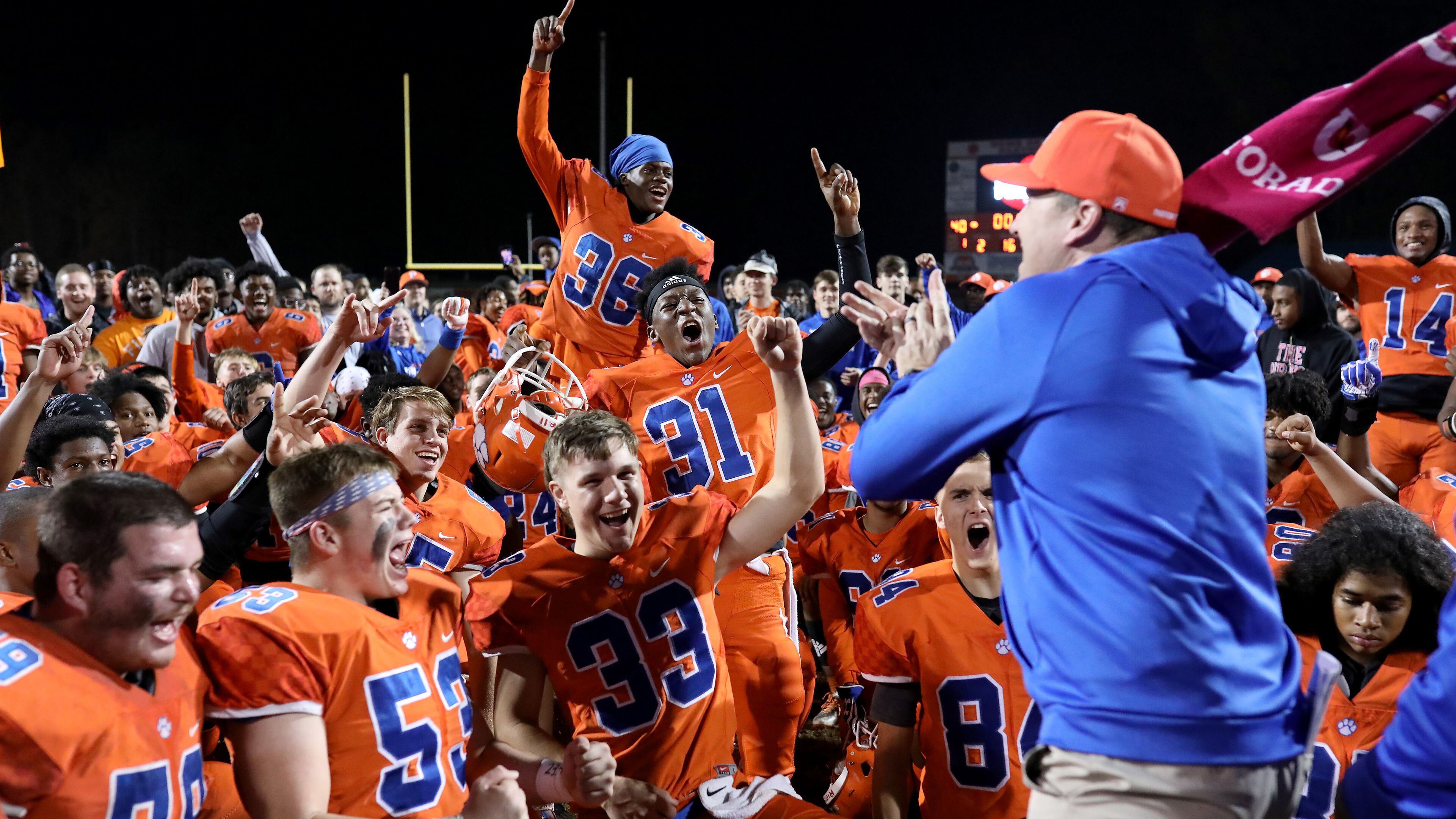 On to the next round: Parkview players celebrate with head coach Eric Godfree after their 40-21 win over Colquitt County Friday in the second round of the Class AAAAAAA playoffs. (Jason Getz/Special)