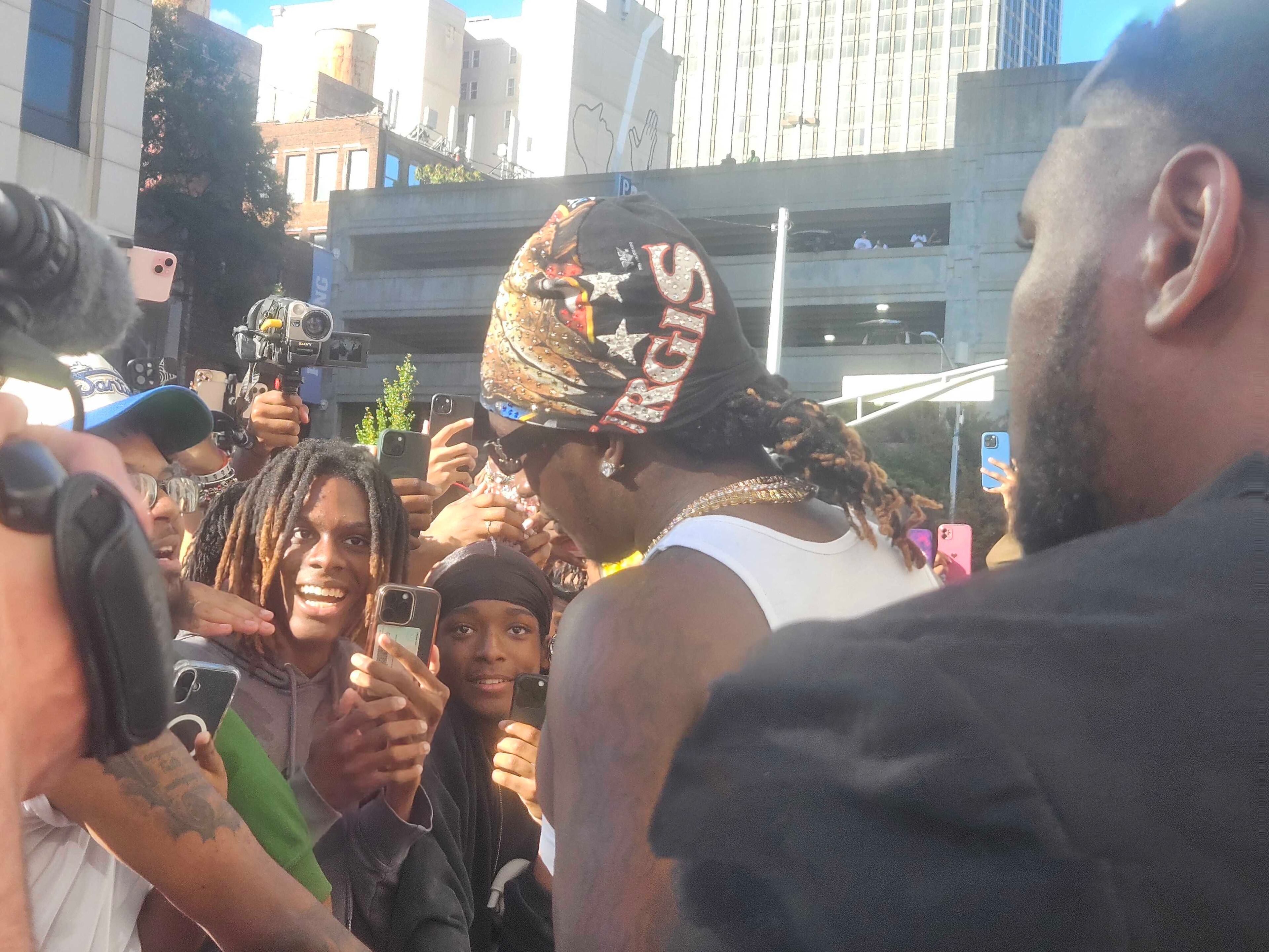 Young Thug interacted with fans and signed autographs during his free concert at the Fulton County Courthouse on Sunday. (DeAsia Paige/AJC)