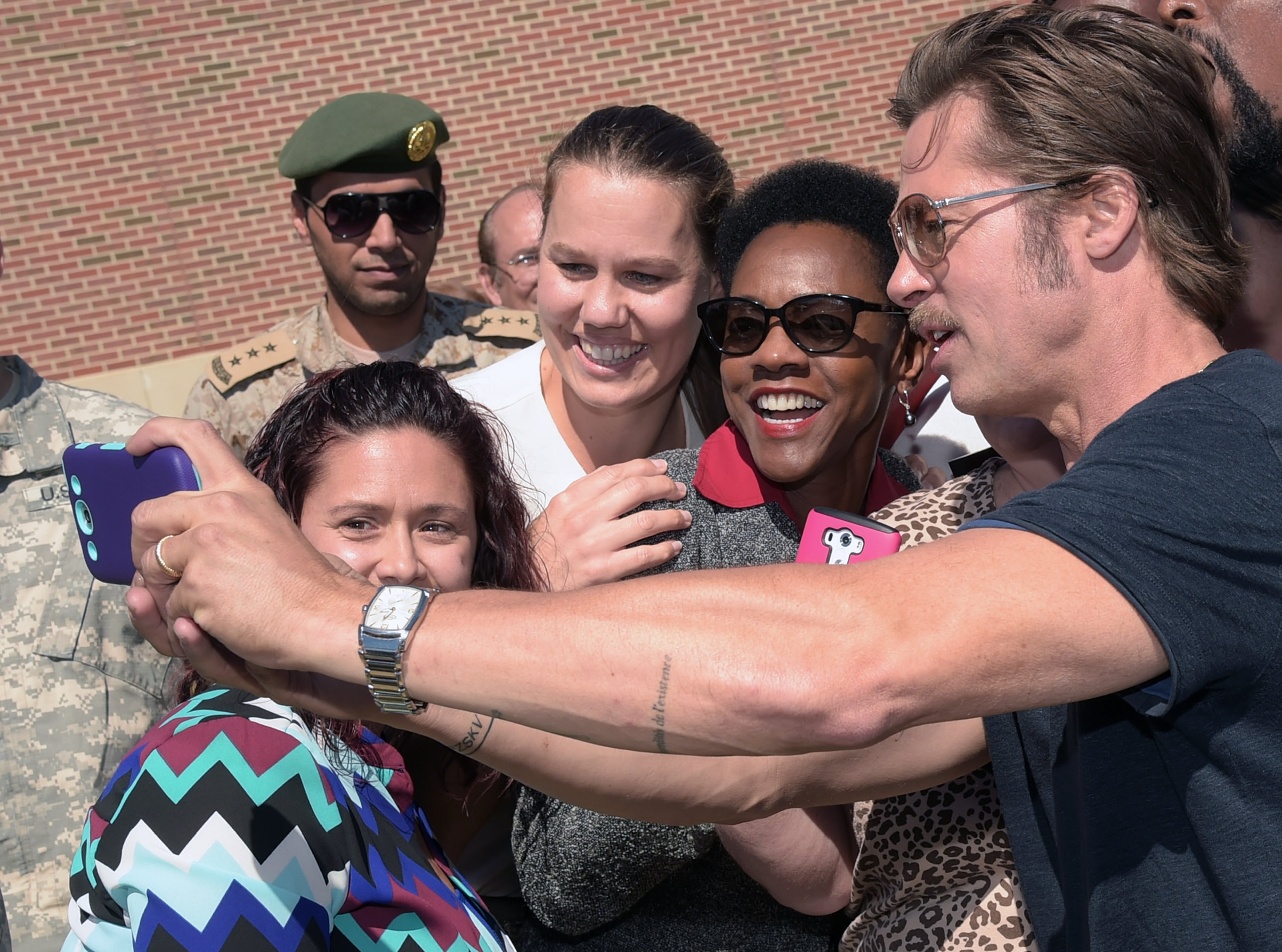 COLUMBUS, GA - OCTOBER 16: Actor Brad Pitt poses with Miltary Wives before "Fury" - Fort Benning Special Screening on October 16, 2014 in Columbus, Georgia. (Photo by Rick Diamond/Getty Images for Sony Pictures)
