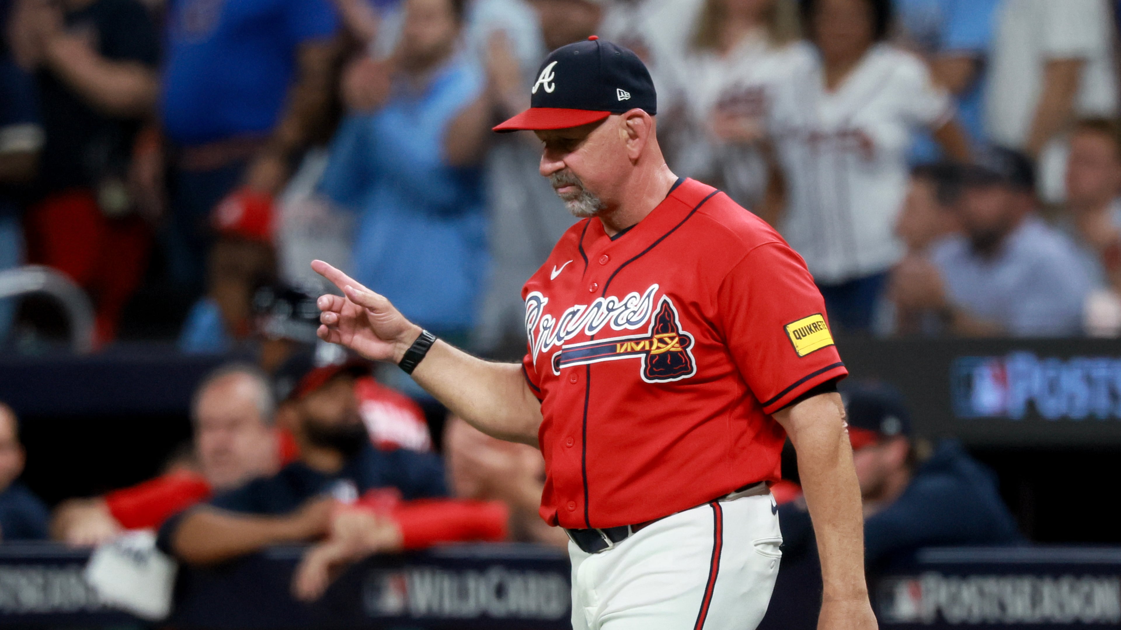 Atlanta Braves manager Walt Weiss signals a pitching change against the Philadelphia Phillies during the fourth inning of Game 3 of a MLB National League Wild Card playoff series between the Atlanta Braves and the Philadelphia Phillies, Thursday, Oct. 1, 2026, in Atlanta. (Jason Getz/AJC)