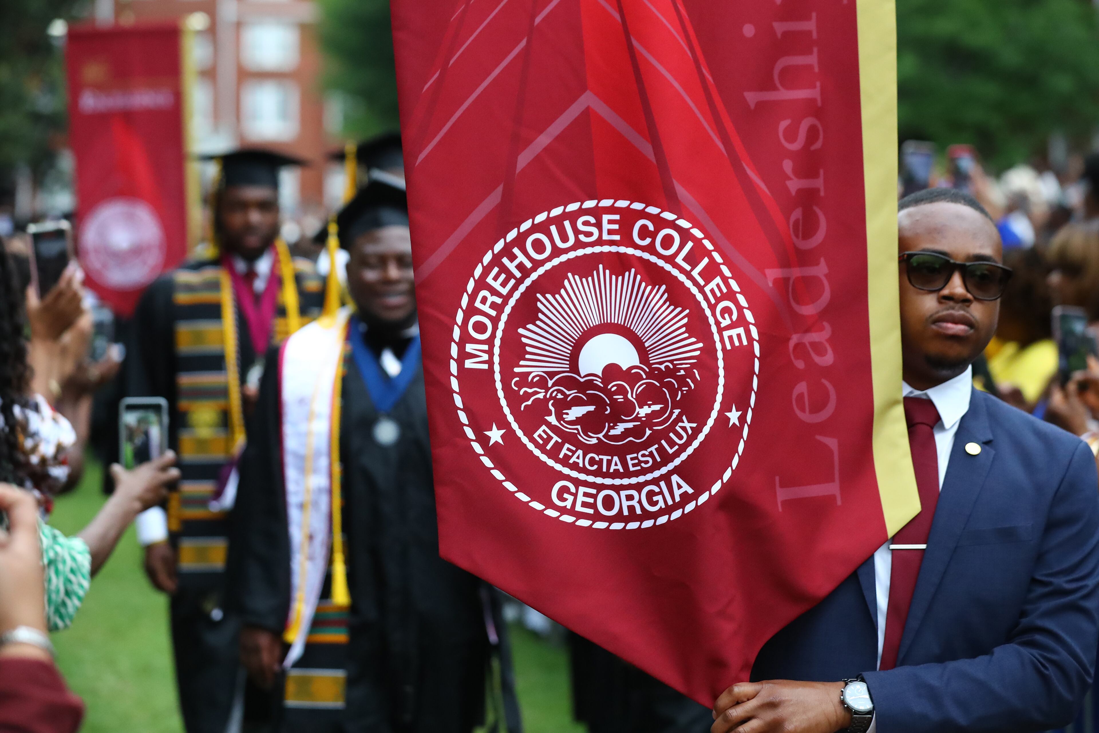 The processional makes it's way through the crowd to the stage for the Morehouse College 138th Commencement Ceremony on Sunday, May 15, 2022, in Atlanta. Curtis Compton / Curtis.Compton@ajc.com