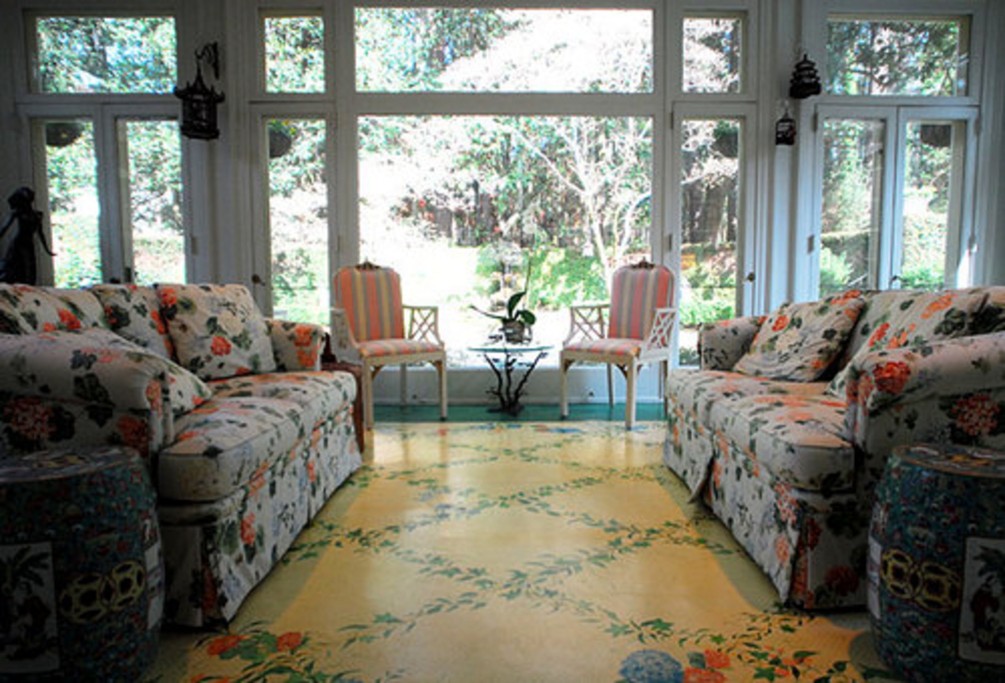 The Garden Room is Anne Colgin's favorite. She commissioned artists Catherine Arnett and Jim Chadwick to paint the floor and ceiling.