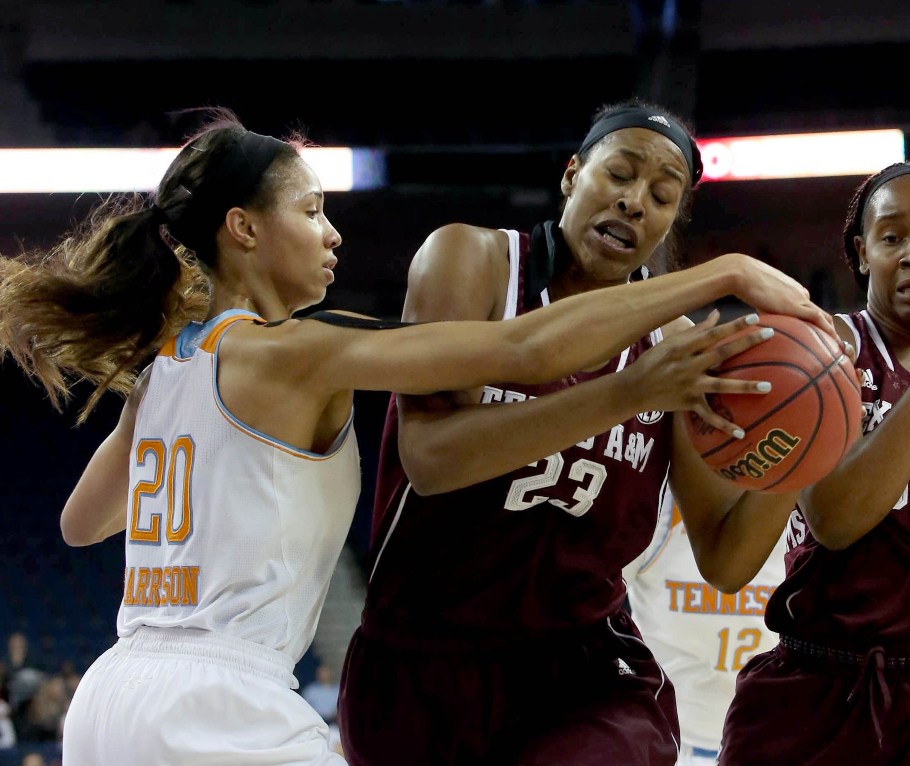 Tennessee center Isabelle Harrison (20) and Texas A&M center Rachel Mitchell (23) fight for a rebound during Tennessee's win over Texas A&M in the fourth-round of the Women's Southeastern Conference NCAA college basketball game, Saturday, March 8, 2014, in Duluth, Ga. Tennessee defeated Texas A&M 86-77. (AP Photo/Jason Getz)
