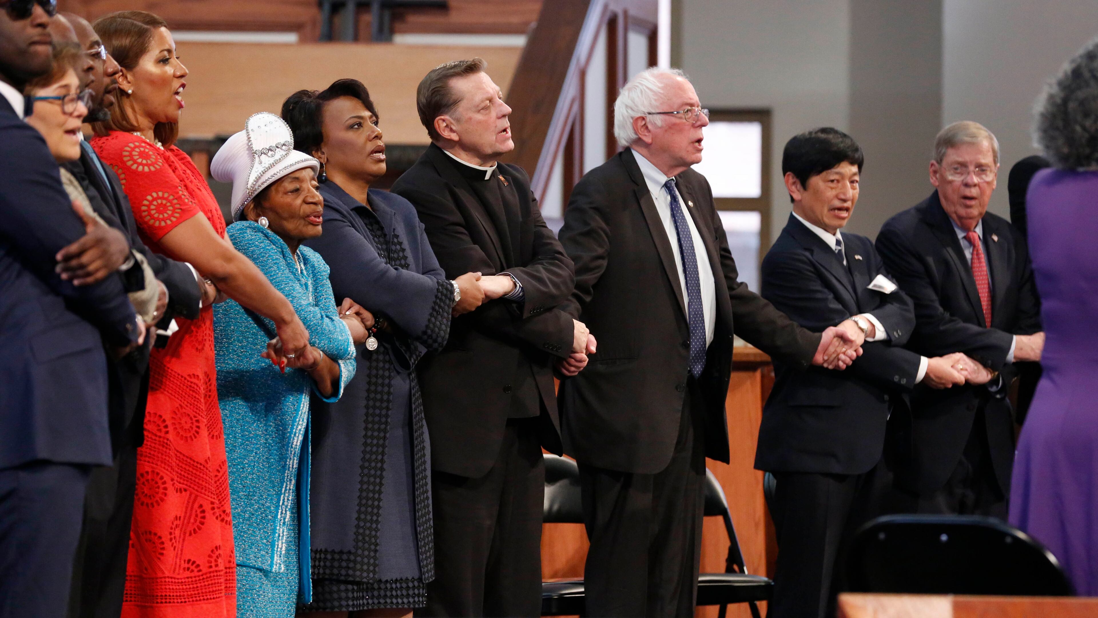January 16, 2017 - Atlanta, Ga: Special guests lock arms and sing "We Shall Overcome," during the 49th annual Martin Luther King Jr. Commemorative Service at Ebenezer Baptist Church Monday, January 16, 2017, in Atlanta, Ga. Pictured are from left to right; Christine King Farris (third from left), Bernice King, Father Michael Pfleger, Senator Bernie Sanders, Consulate General of Japan Takashi Shinozuka, and Senator Johnny Isakson. PHOTO / JASON GETZ