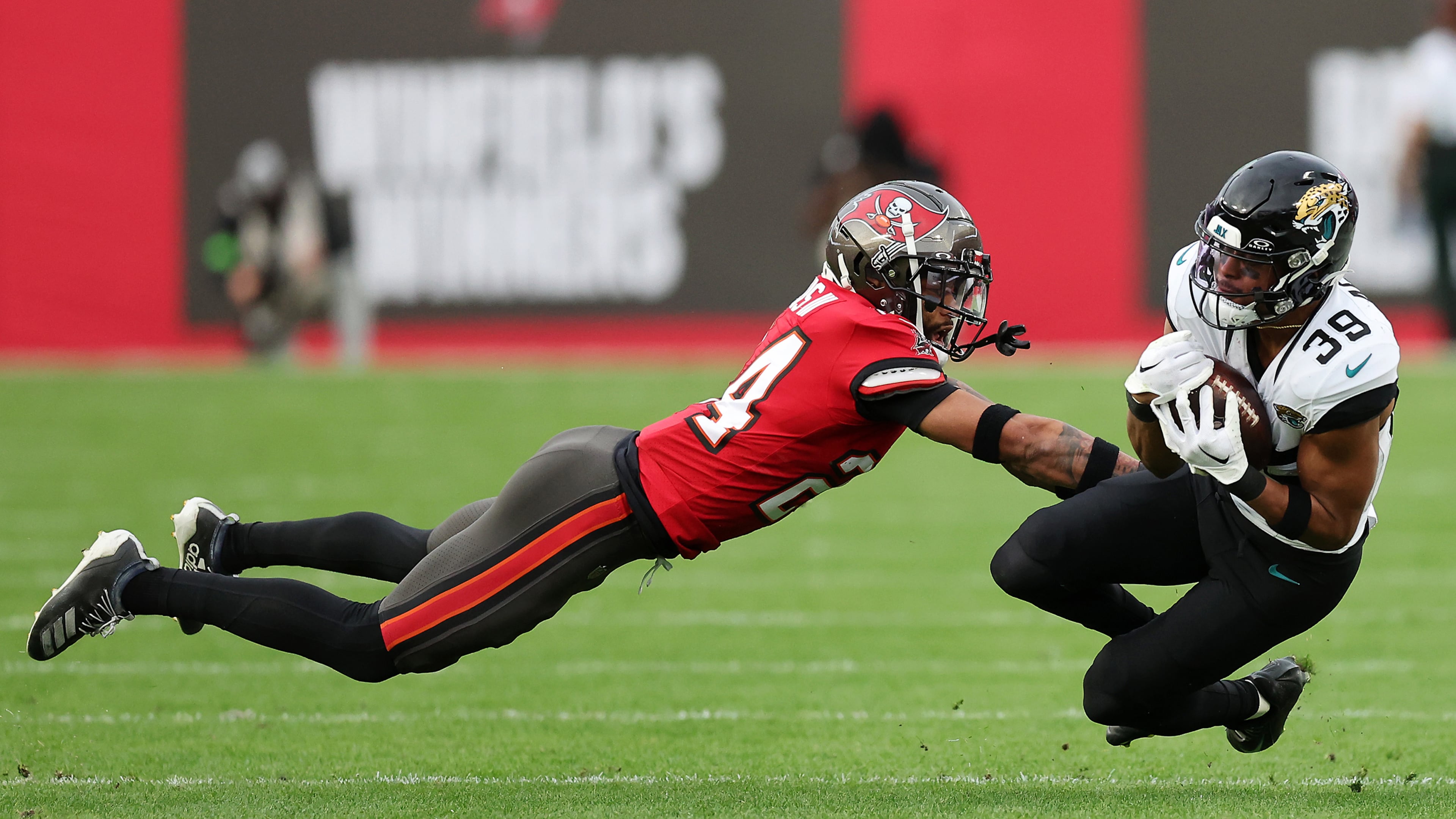 Jacksonville Jaguars wide receiver Jamal Agnew (39) catches a pass against Tampa Bay Buccaneers cornerback Carlton Davis III during the second quarter at Raymond James Stadium on Dec. 24, 2023, in Tampa, Florida. Agnew now plays for the Falcons. (Mike Carlson/Getty Images/TNS)