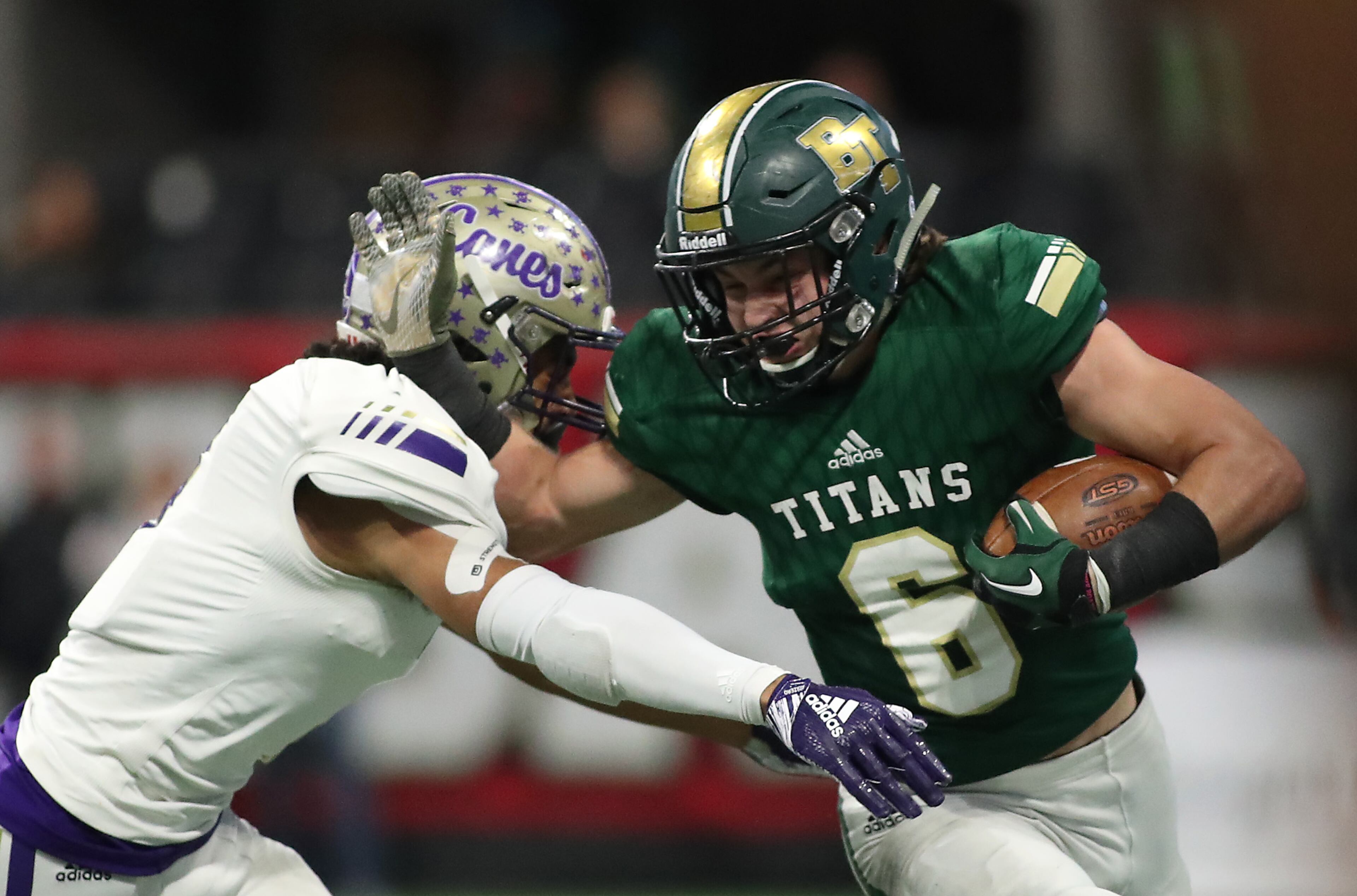 Blessed Trinity wide receiver Ryan Davis (6) is pushed out of bounds by Cartersville defensive back Marko Dudley (7) after a catch by Davis in the first half of the Class AAAA State Championship at Mercedes-Benz Stadium Wednesday, December 12, 2018, in Atlanta. (Jason Getz/Special to the AJC)