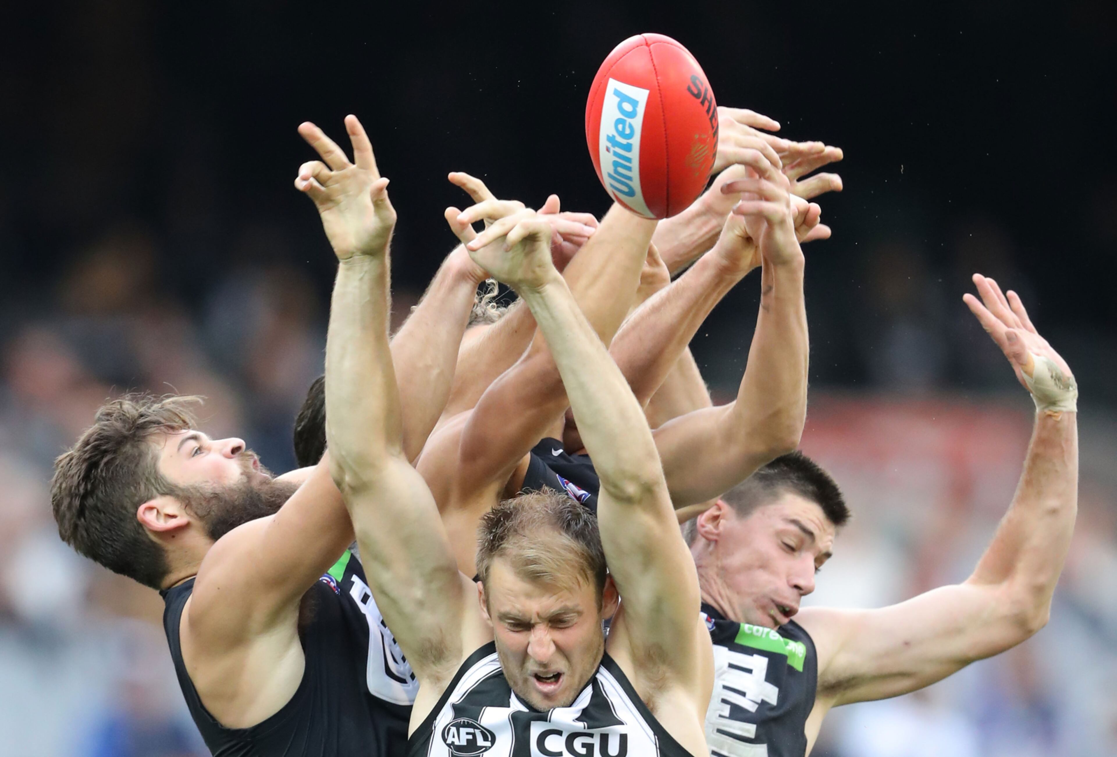 MELBOURNE, VICTORIA - MAY 06: Ben Reid of the Magpies, Matthew Kreuzer of the Blues and Levi Casboult of the Blues compete for the ball during the round seven AFL match between the Collingwood Magpies and the Carlton Blues at Melbourne Cricket Ground on May 6, 2017 in Melbourne, Australia. (Photo by Scott Barbour/AFL Media/Getty Images) *** BESTPIX ***