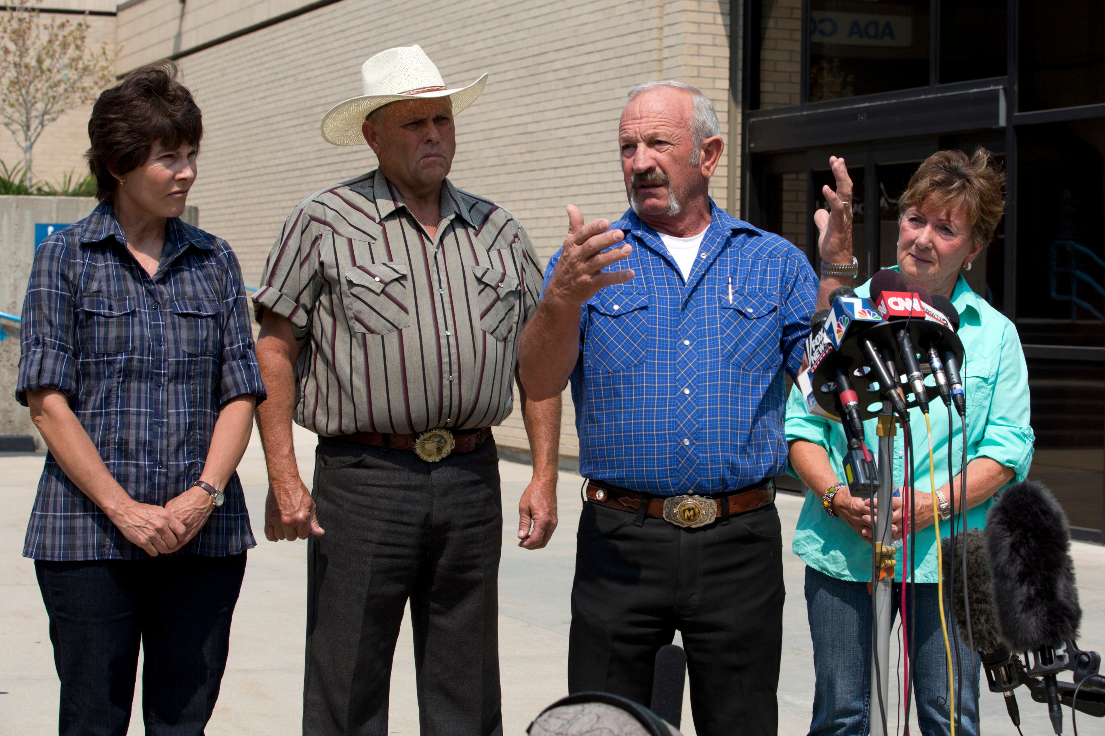 Standing out in front of the Ada County Sheriff's Office in Boise, witnesses, from left to right, Mary Young, Mike Young, Mark John and Christa John speak Sunday Aug. 11, 2013 with news reporters about their sighting of Hannah Anderson and James DiMaggio out Morehead Lake. (AP Photo/UT San Diego, Nelvin C. Cepeda)