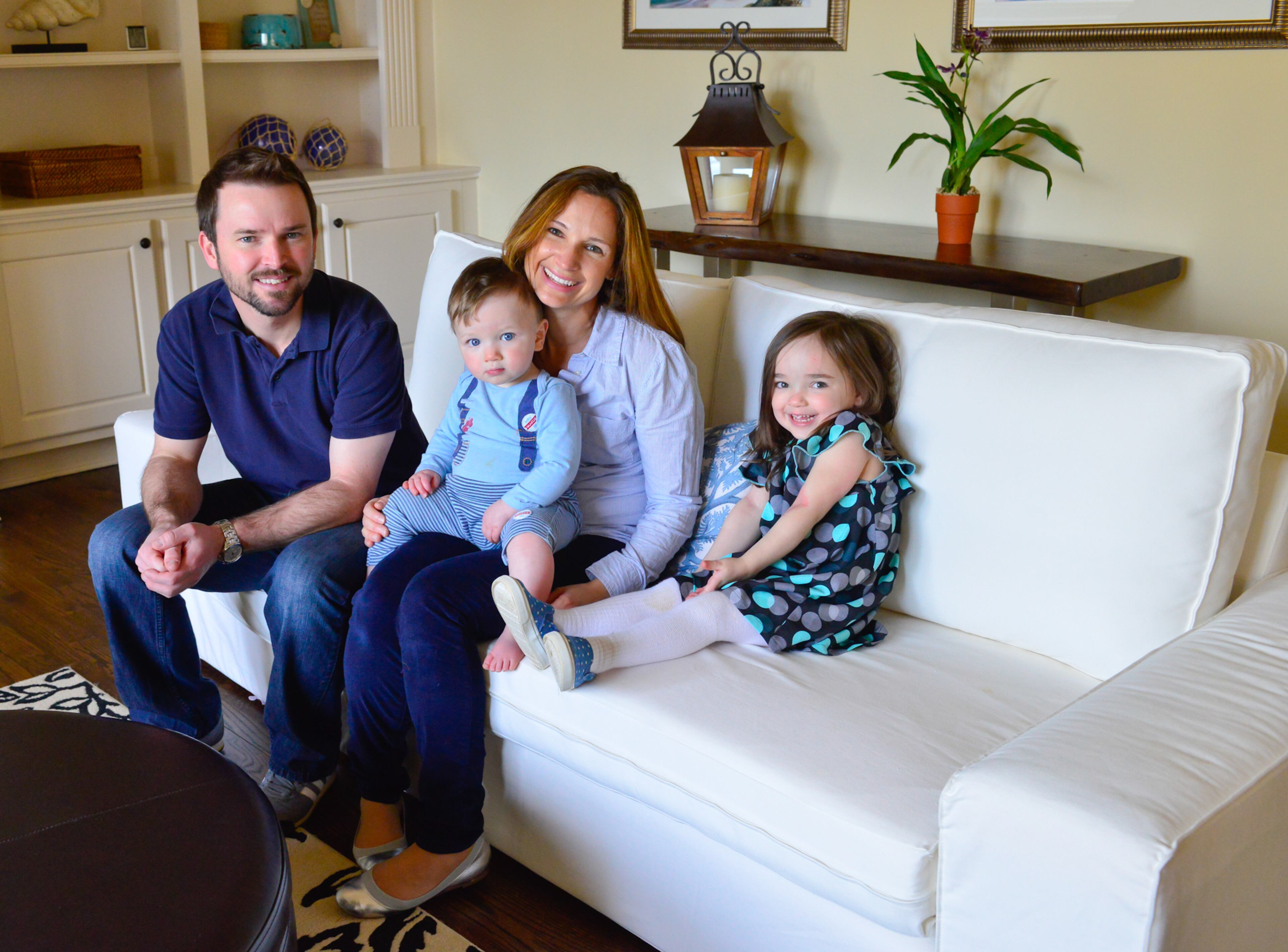 Justin and Sophia Decouto moved into their new five-bedroom, four-bath Milton residence by Edward Andrews Homes in 2013. The living room couches are from Ikea and have washable covers on the cushions that come in handy with their young children, Ashlyn and Evan.