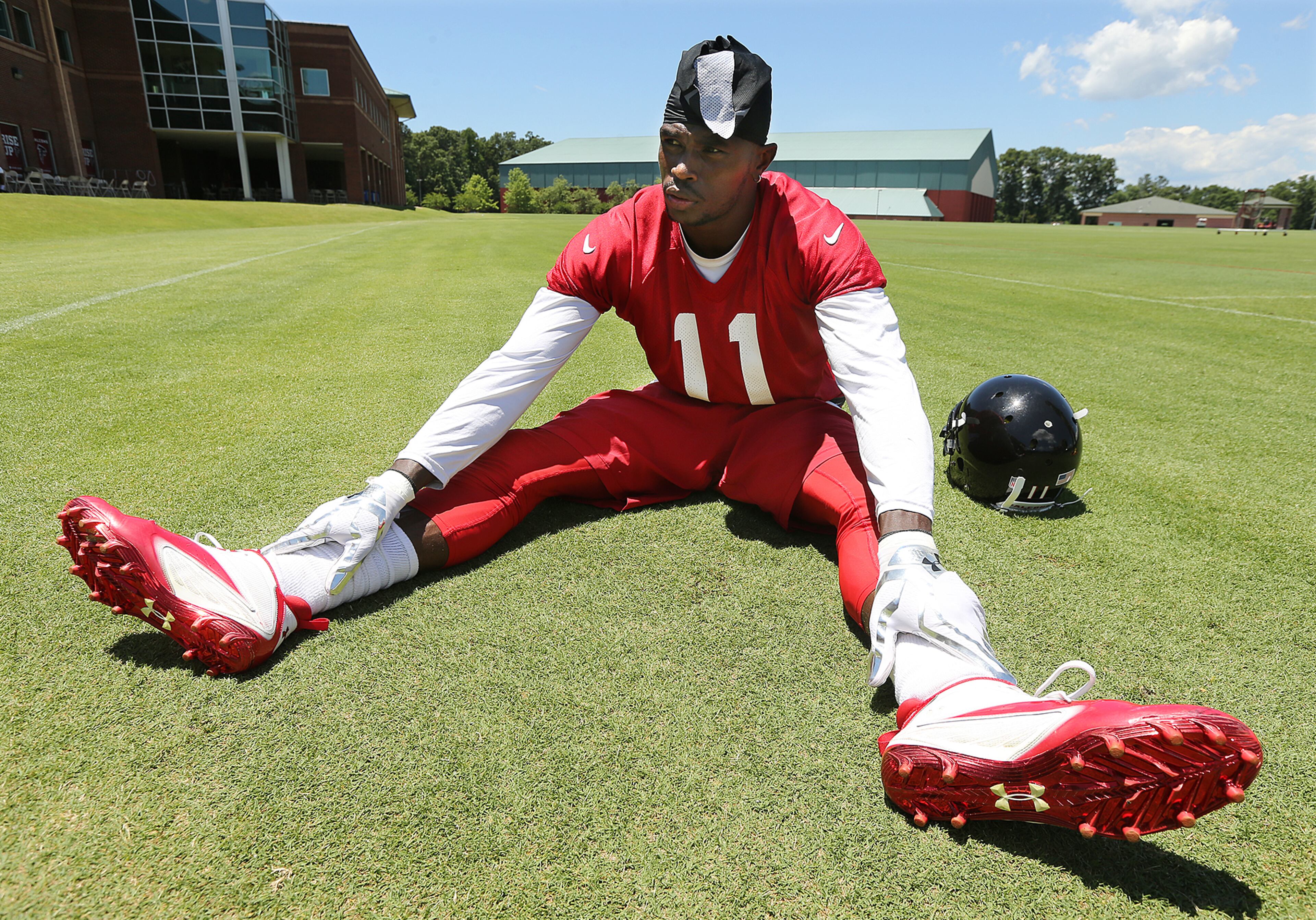 Falcons wide receiver Julio Jones stretches out during an OTA day on Tuesday, June 7, 2016, in Flowery Branch. Curtis Compton / ccompton@ajc.com
