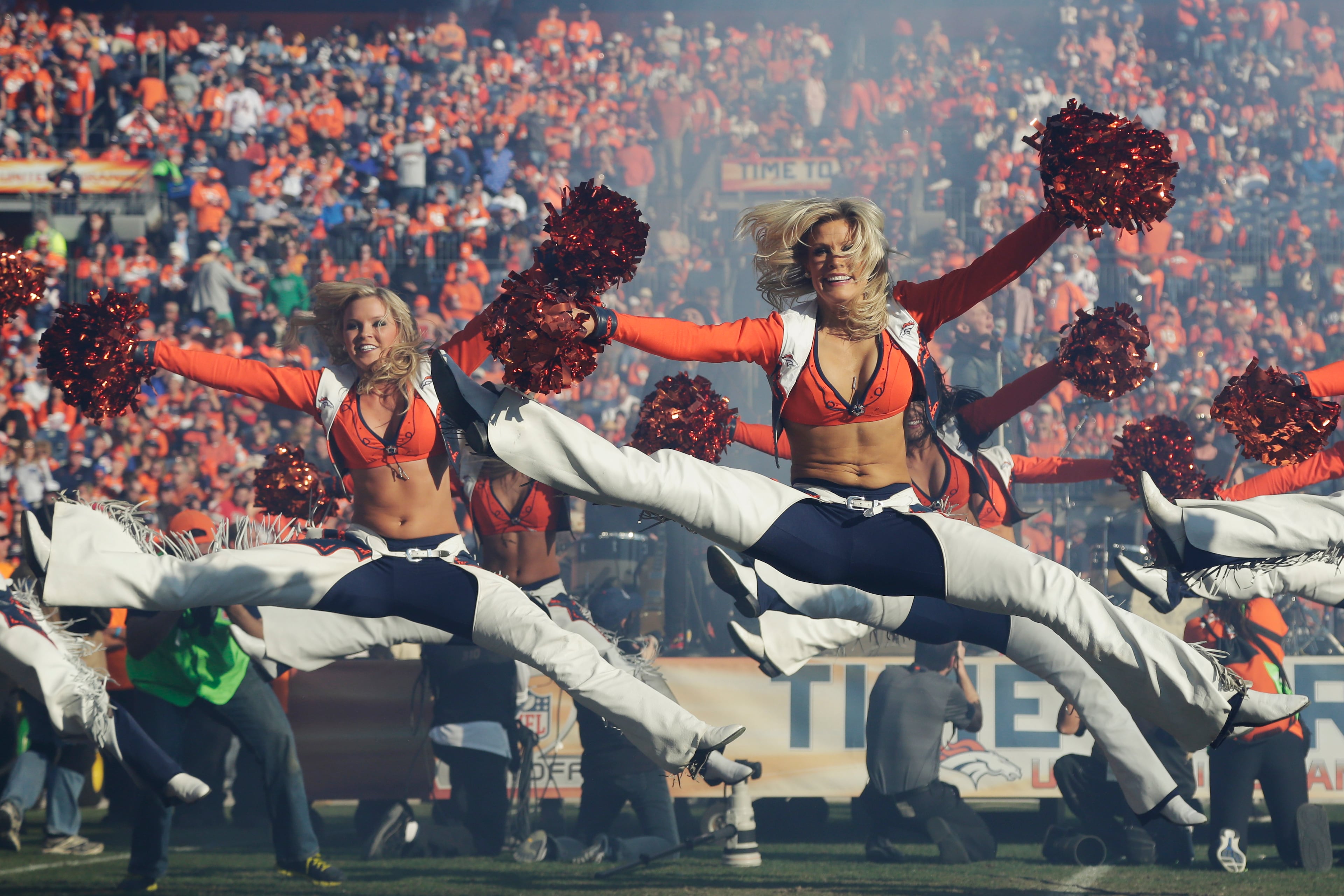 The Denver Broncos cheerleaders preform during the first half of the AFC Championship NFL playoff football game in Denver on Jan. 19, 2014.