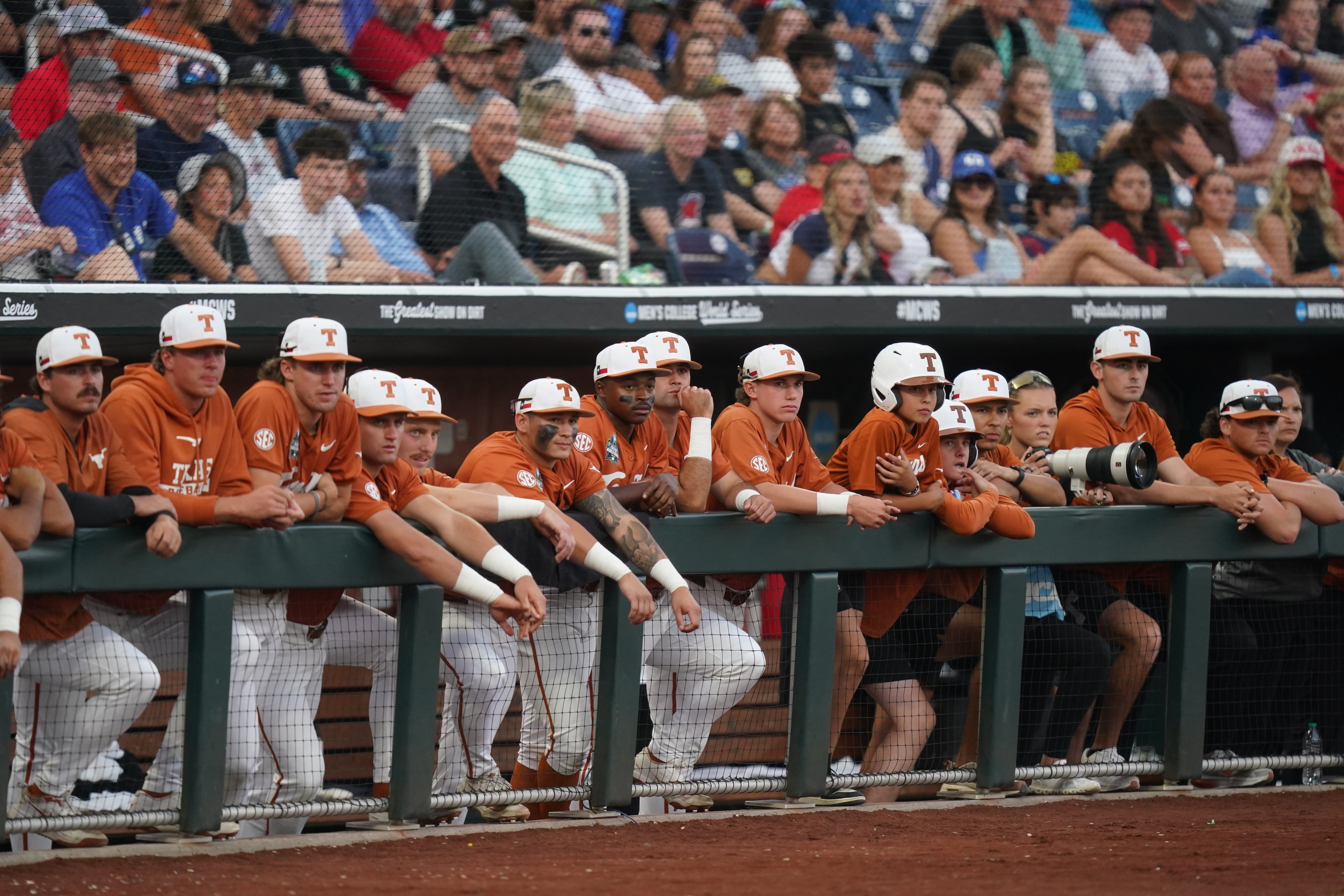 Texas teammates look on from the dugout during an NCAA baseball College World Series elimination game against Georgia, Tuesday, June 16, 2026 in Omaha, Neb. Georgia won 2-0. (AP Photo/Vera Nieuwenhuis)
