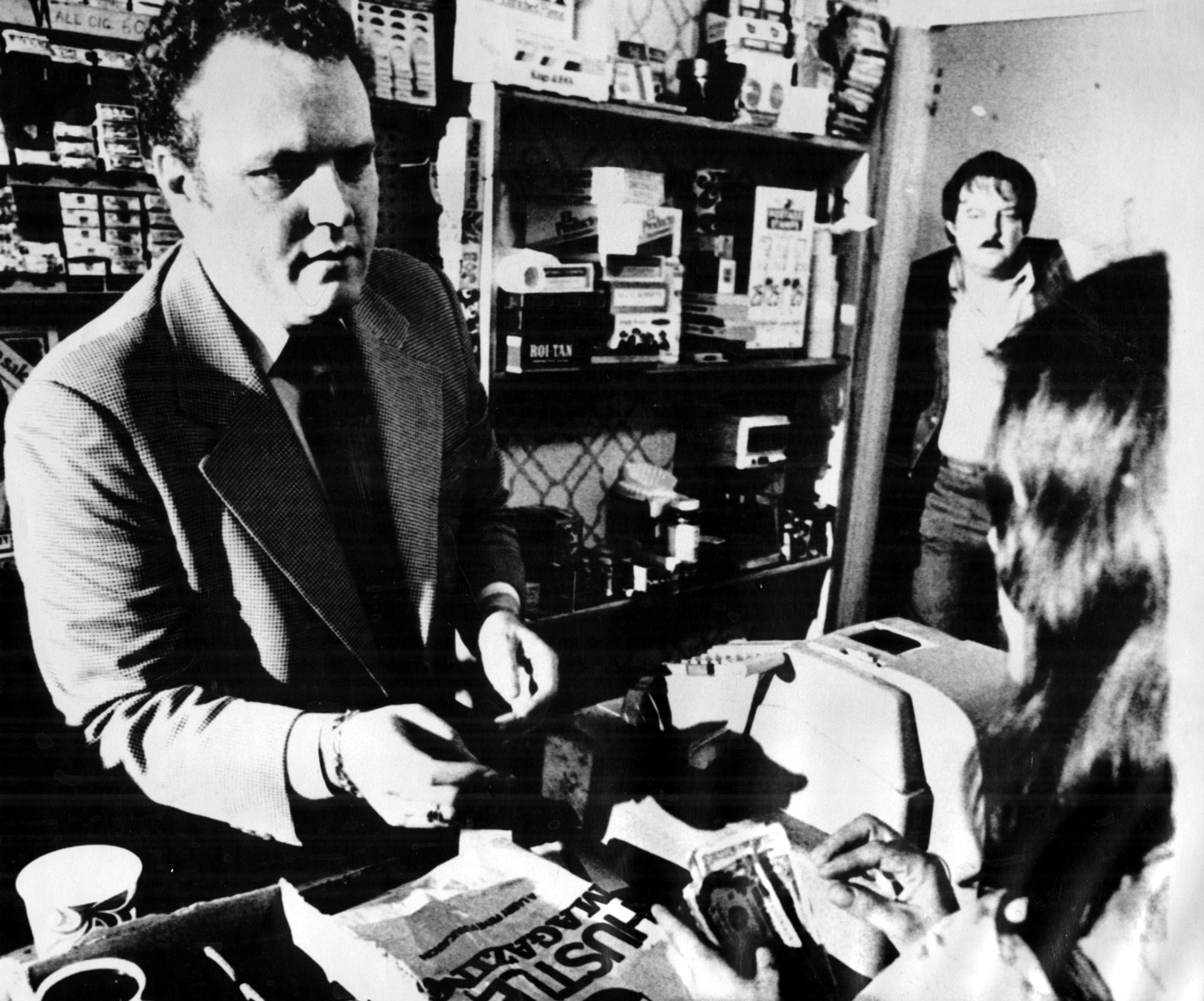 The original 1977 caption for this photo reads: "Hustler Publisher Larry Flynt sells his magazine over the counter of a book shop in Atlanta last year. He leased the shop for a day to sell his magazine, daring local officials to arrest him on obscenity charges.They did and he faces trial in Fulton County, Georgia." The Gwinnett trial was unrelated to the Fulton County incident, although the charges were identical.