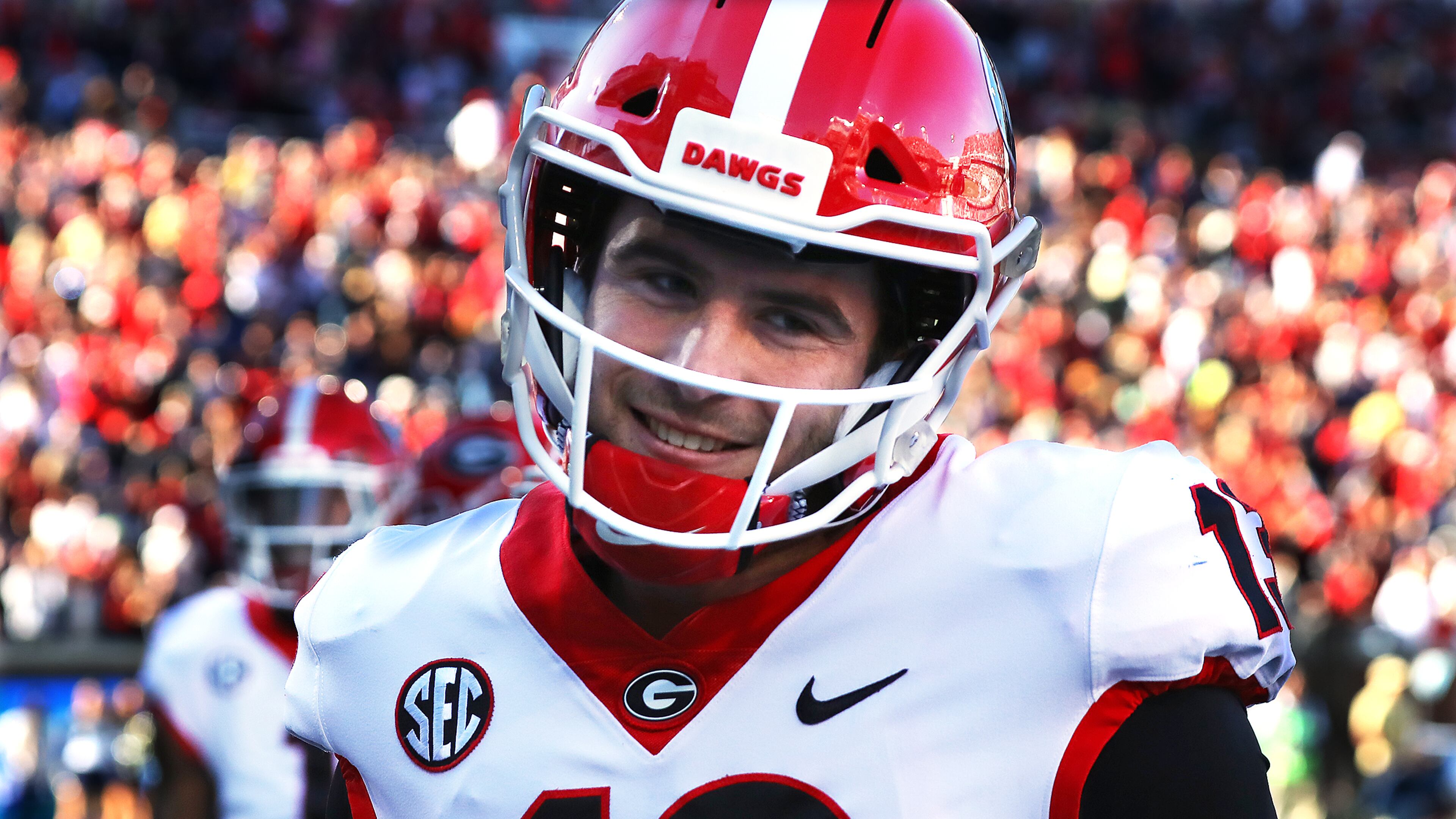 Georgia quarterback Stetson Bennett pumps his fist while celebrating a touchdown by running back Kenny McIntosh during the third quarter in a 45-0 shutout over Georgia Tech in NCAA college football game on Saturday, Nov. 27, 2021, in Atlanta. “Curtis Compton / Curtis.Compton@ajc.com”`