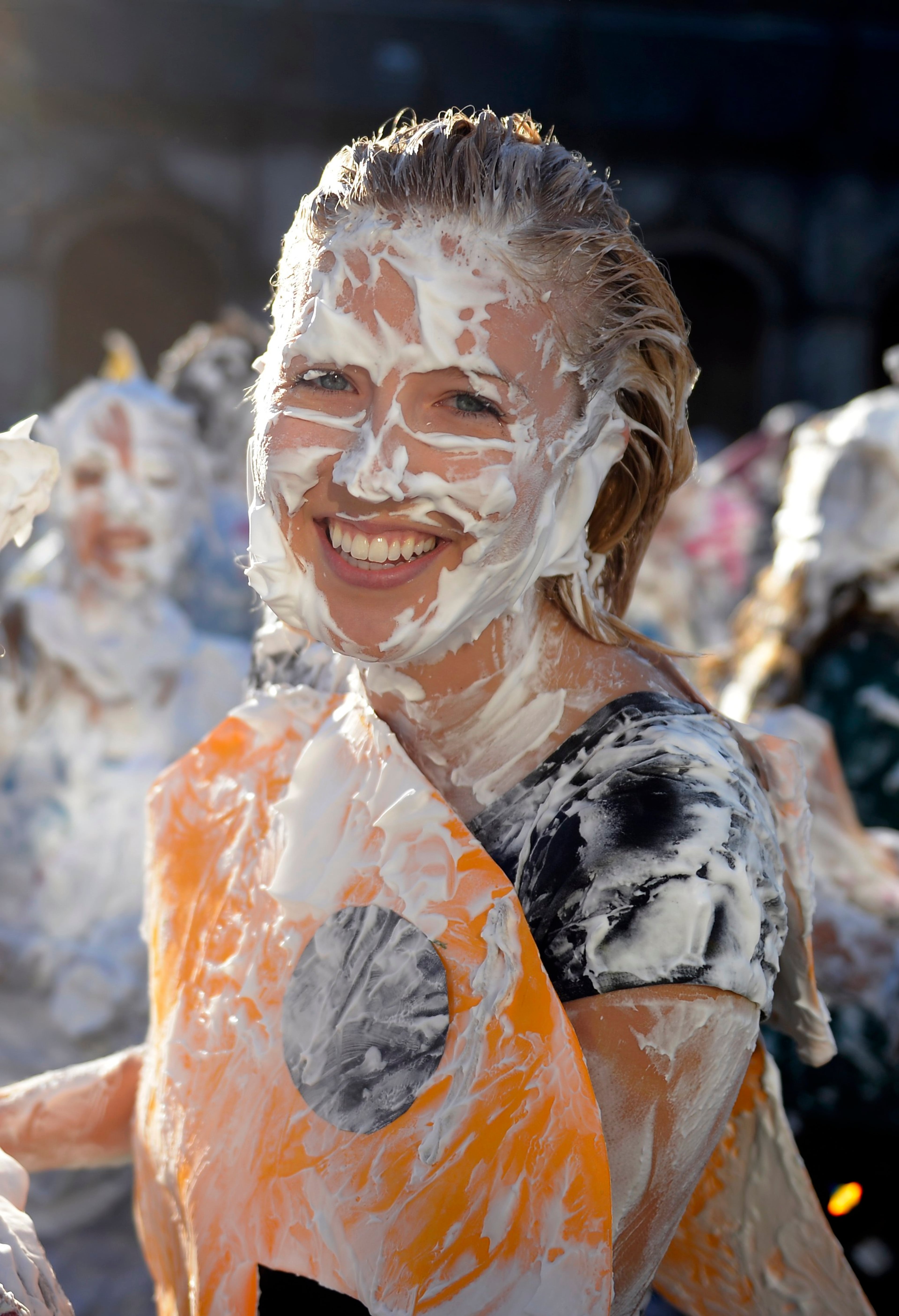 Students from St Andrews University are covered in foam as they take part in the traditional 'Raisin Weekend' in the historic St Salvator's Quad, in St Andrews, Scotland November 4, 2013. The weekend, which begins on Sunday, involves rituals for new students, culminating in a foam fight on Monday morning. REUTERS/Russell Cheyne