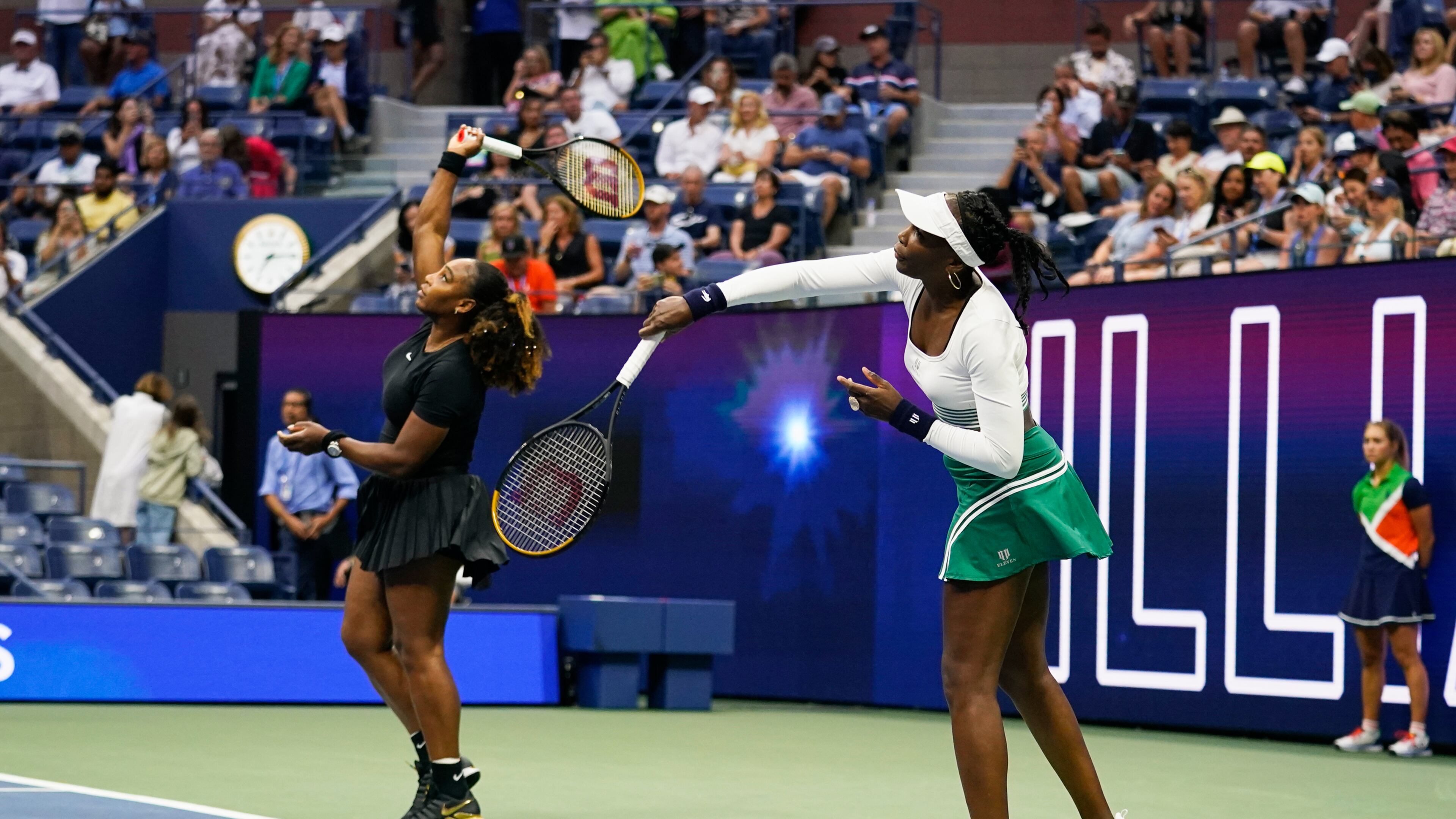 FILE - Serena Williams, left, and Venus Williams, of the United States, warm up before their first-round doubles match against Lucie Hradecká and Linda Nosková, of the Czech Republic, at the U.S. Open tennis championships, Sept. 1, 2022, in New York. (AP Photo/Charles Krupa, File)