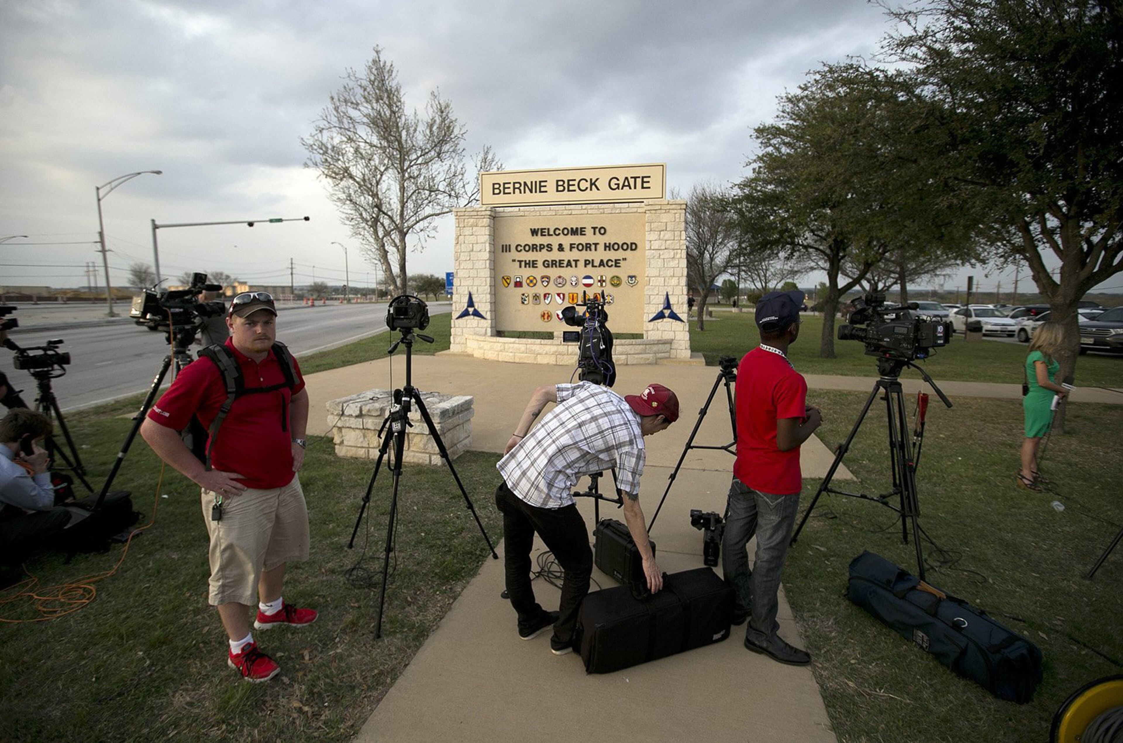 Media wait for an official statement at the Bernie Beck Main Gate at Fort Hood, Texas, on Wednesday, April 2, 2014, following a shooting at the base.