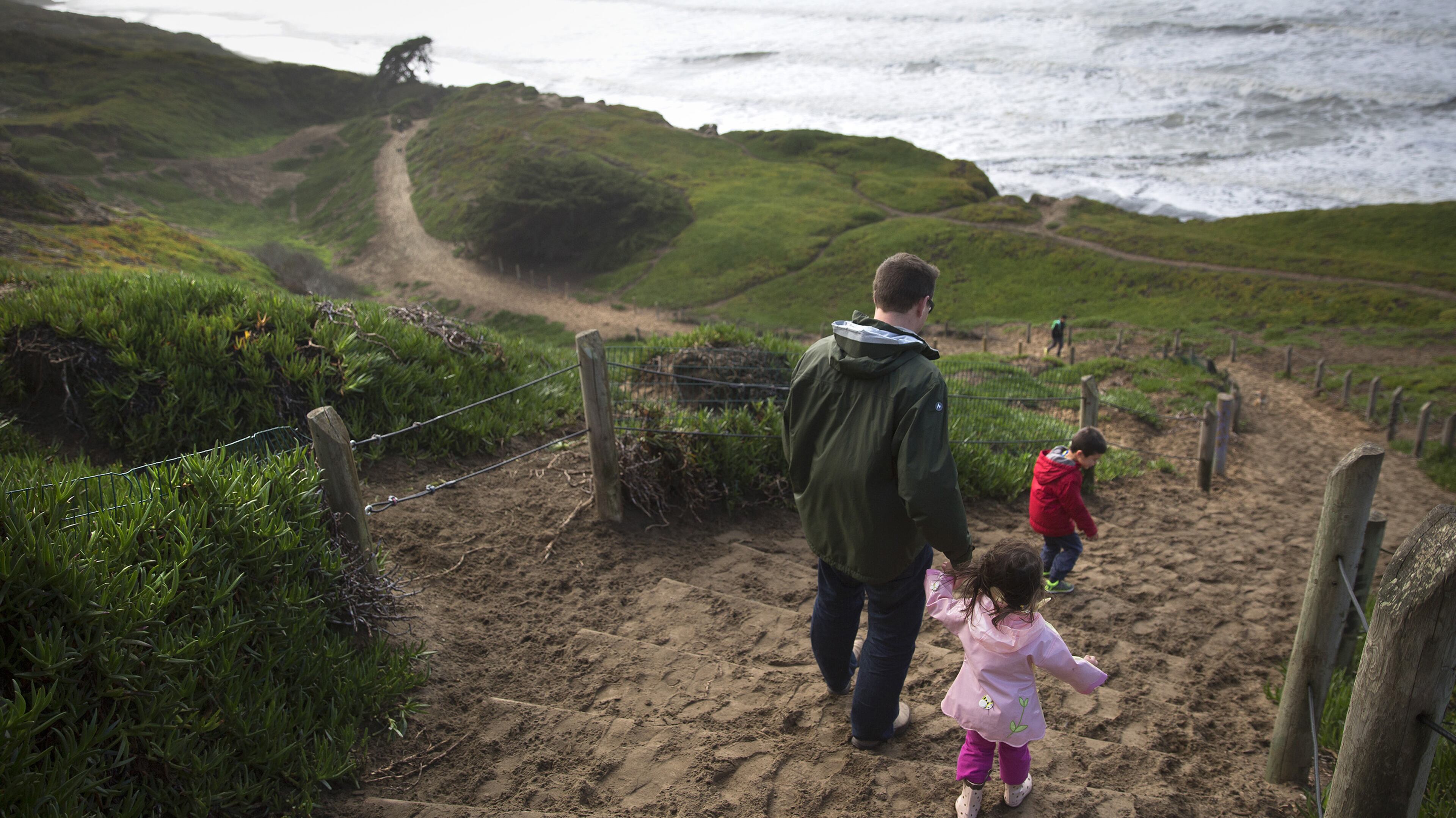 Visitors walk down the sand ladder to the beach at Fort Funston in the Golden Gate National Recreation Area in San Francisco. (Brian van der Brug/Los Angeles Times/TNS)