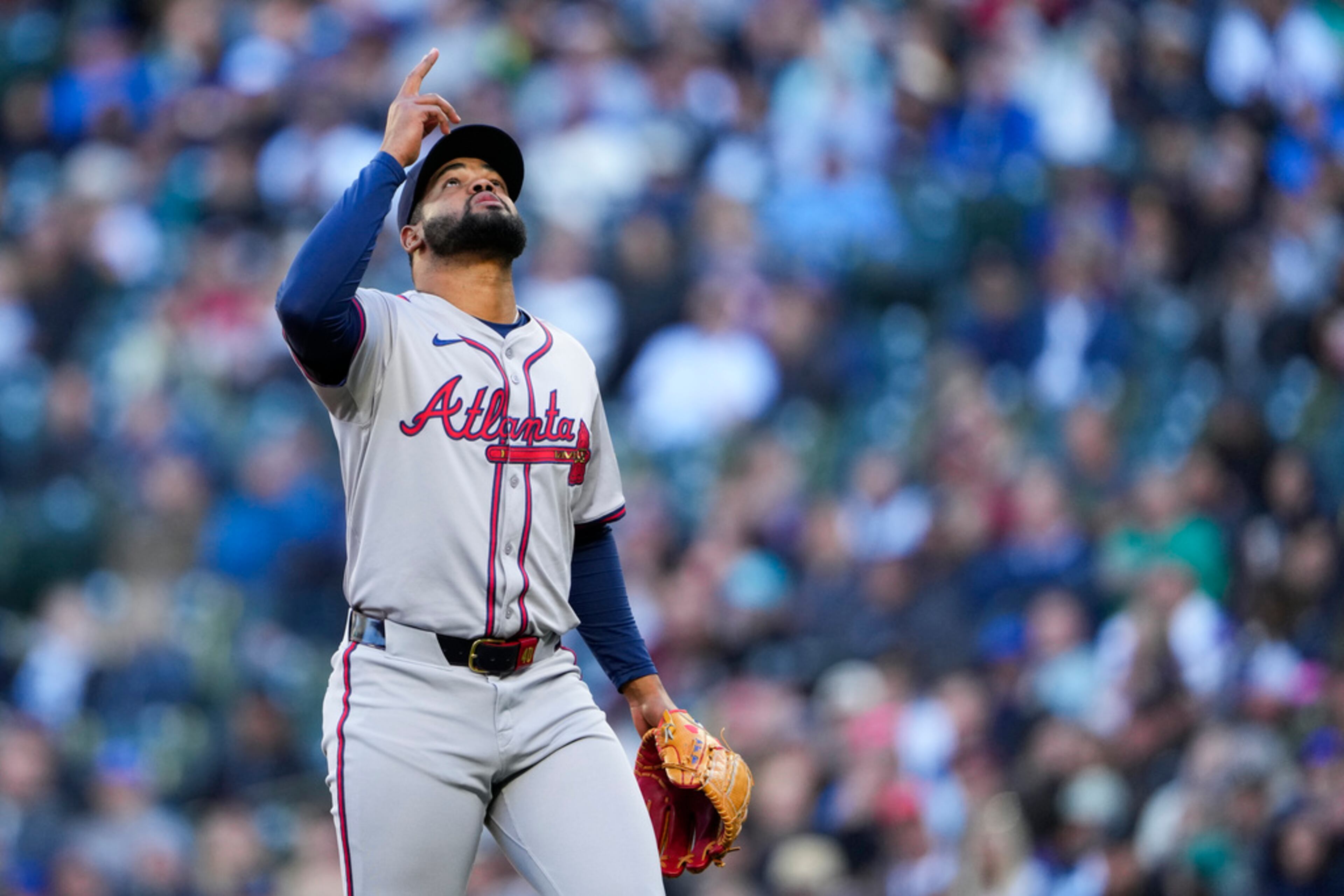 Atlanta Braves starting pitcher Reynaldo López points after pitching through the first inning of a baseball game against the Seattle Mariners, Tuesday, April 30, 2024, in Seattle. (AP Photo/Lindsey Wasson)
