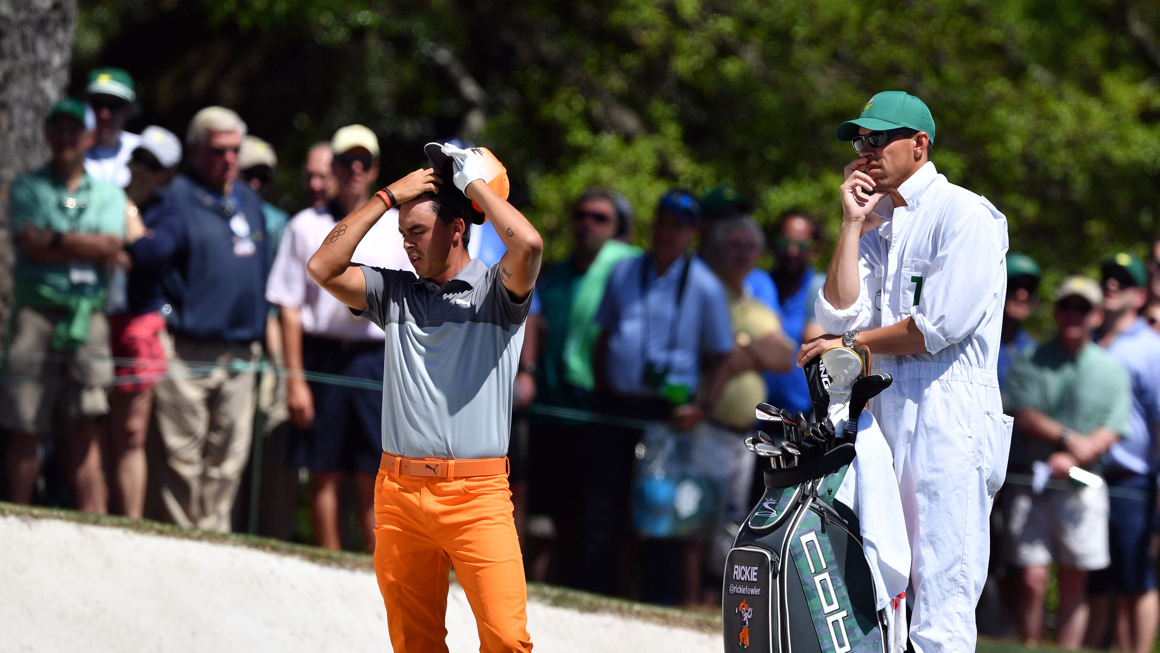Rickie Fowler prepares for his shot in the first fairway bunker. His anticipated run for the championship never happened. BRANT SANDERLIN / SPECIAL