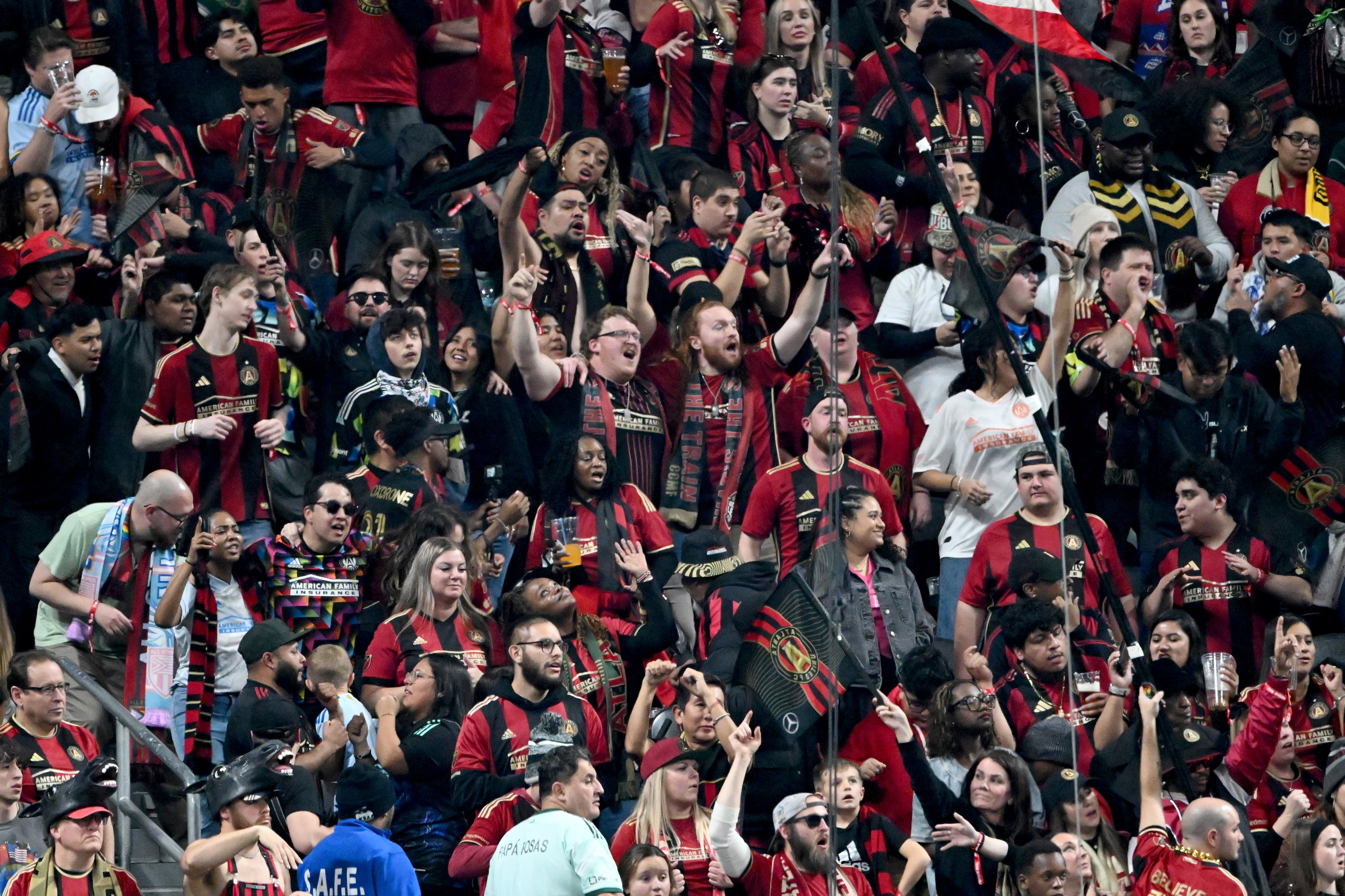 Atlanta United fans cheer during the second half of Atlanta United’s MLS season opener at Mercedes-Benz Stadium, Saturday, February 22, 2025, in Atlanta. Atlanta United won 3-2 over CF Montreal. (Hyosub Shin / AJC)