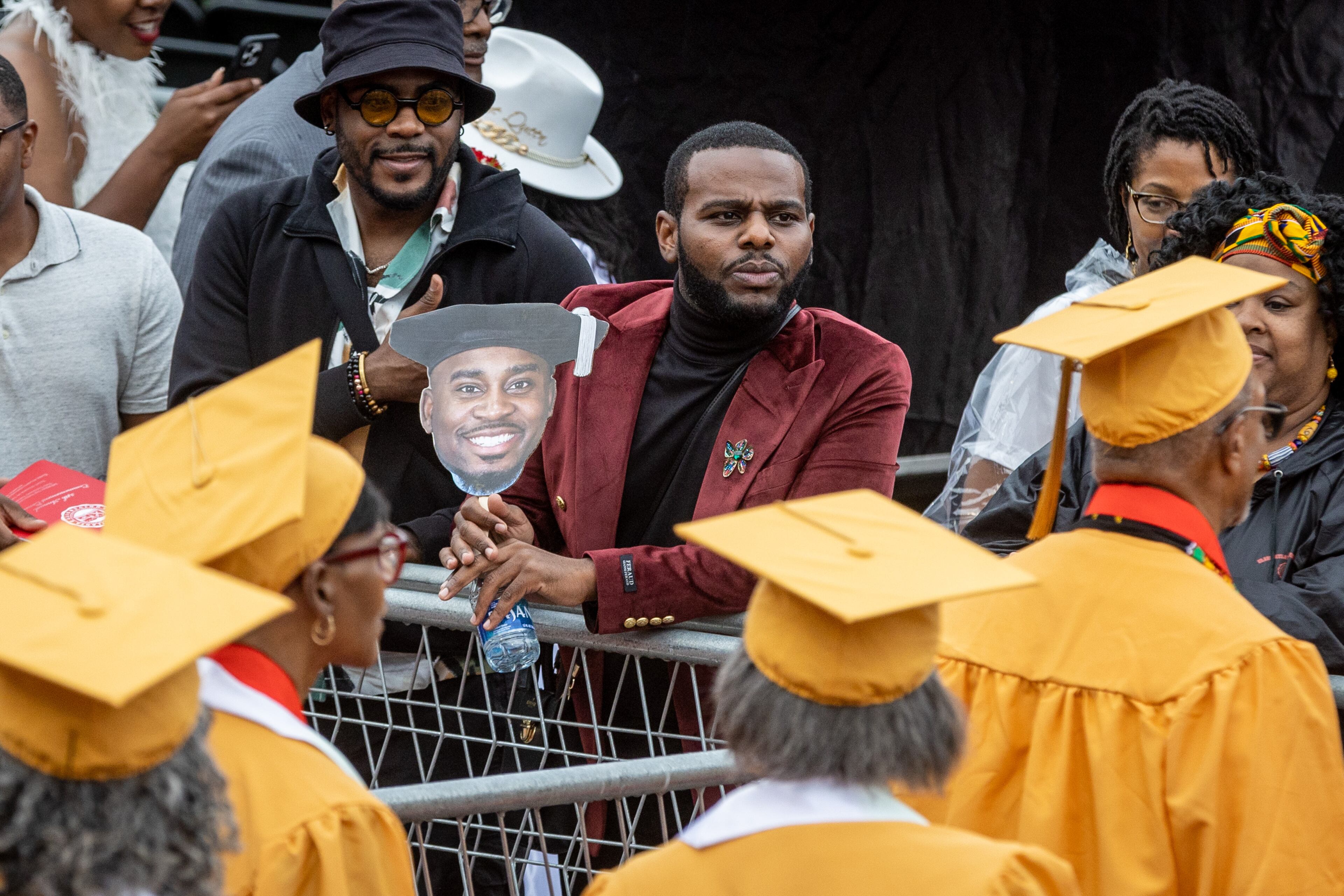 Friends and family try to spot their graduates as they walk into Panther Stadium for the start of Clark Atlanta University's commencement ceremony Saturday, May 20, 2023. (Steve Schaefer / steve.schaefer@ajc.com)