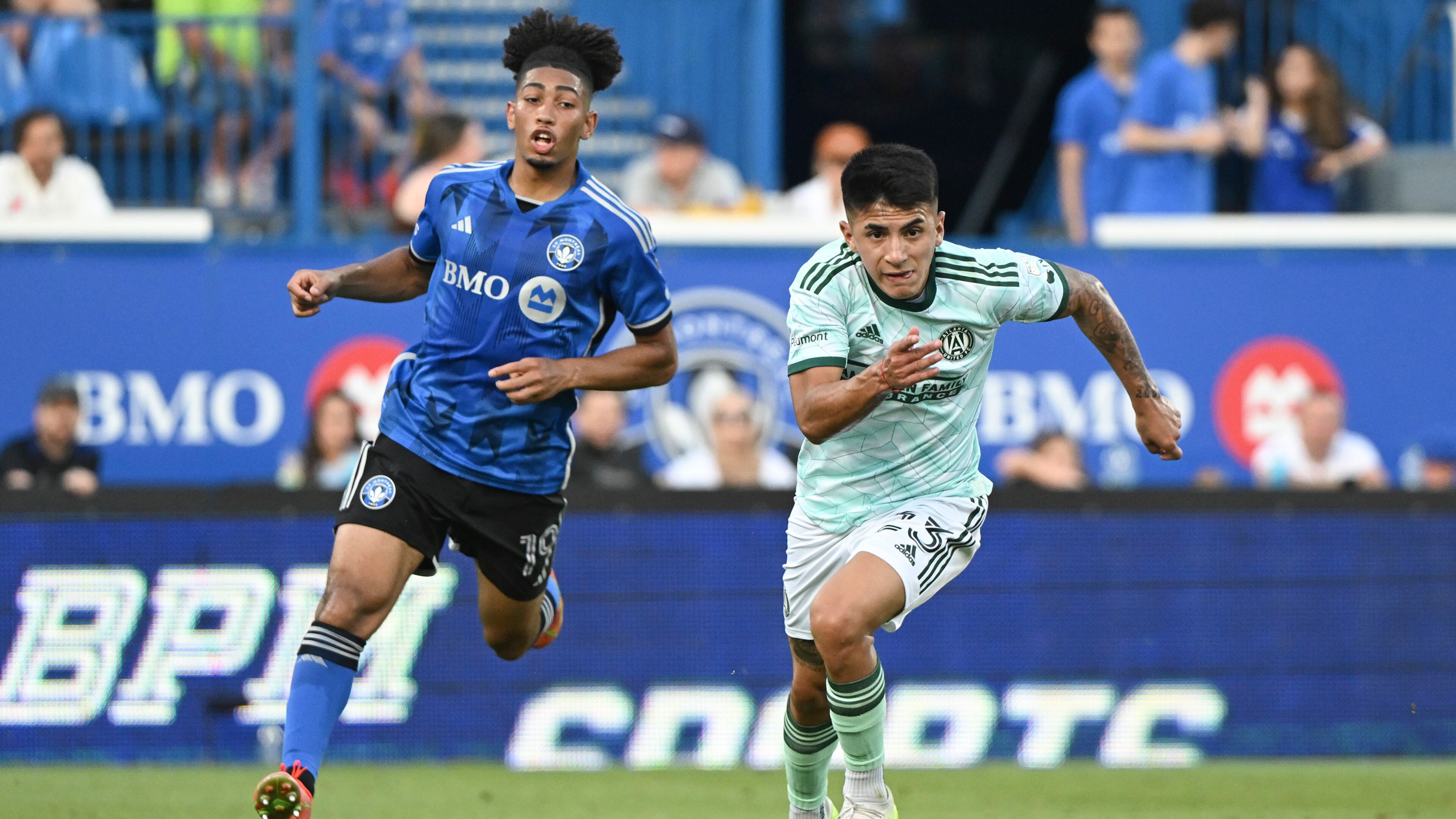 Atlanta United's Thiago Almada (23) breaks away from CF Montreal's Nathan-Dylan Saliba (19) during the first half of an MLS soccer match Saturday, July 8, 2023, in Vancouver, British Columbia. (Graham Hughes/The Canadian Press via AP)