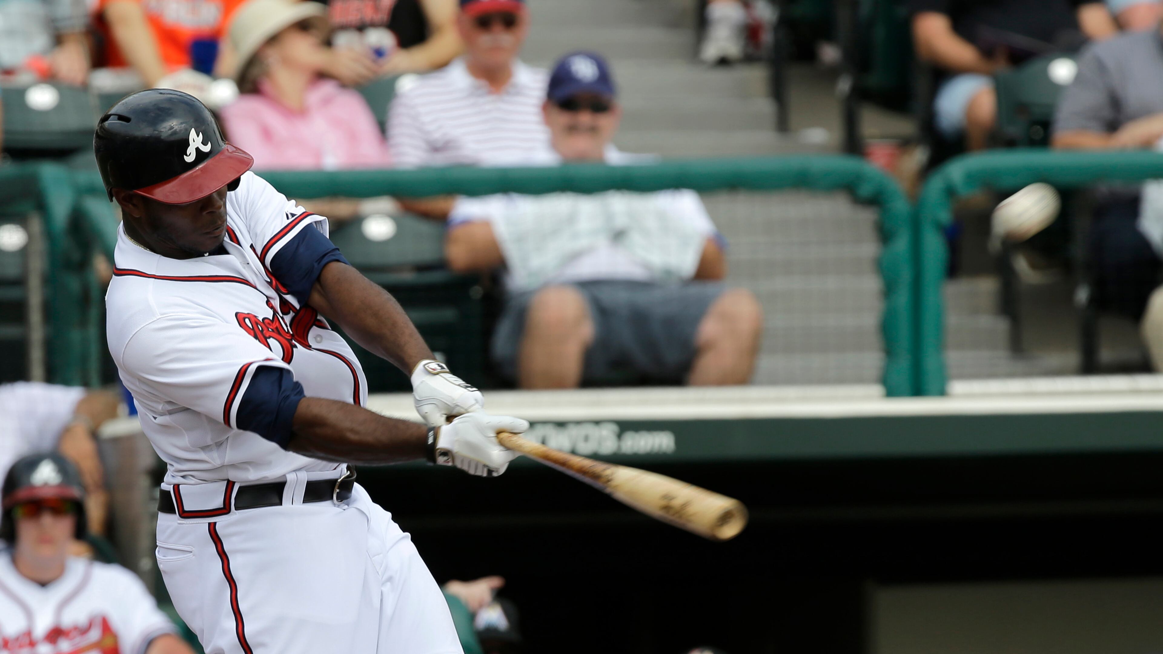 Justin Upton's first hit in three spring games was a monster home run estimated at 450 feet against the Marlins.