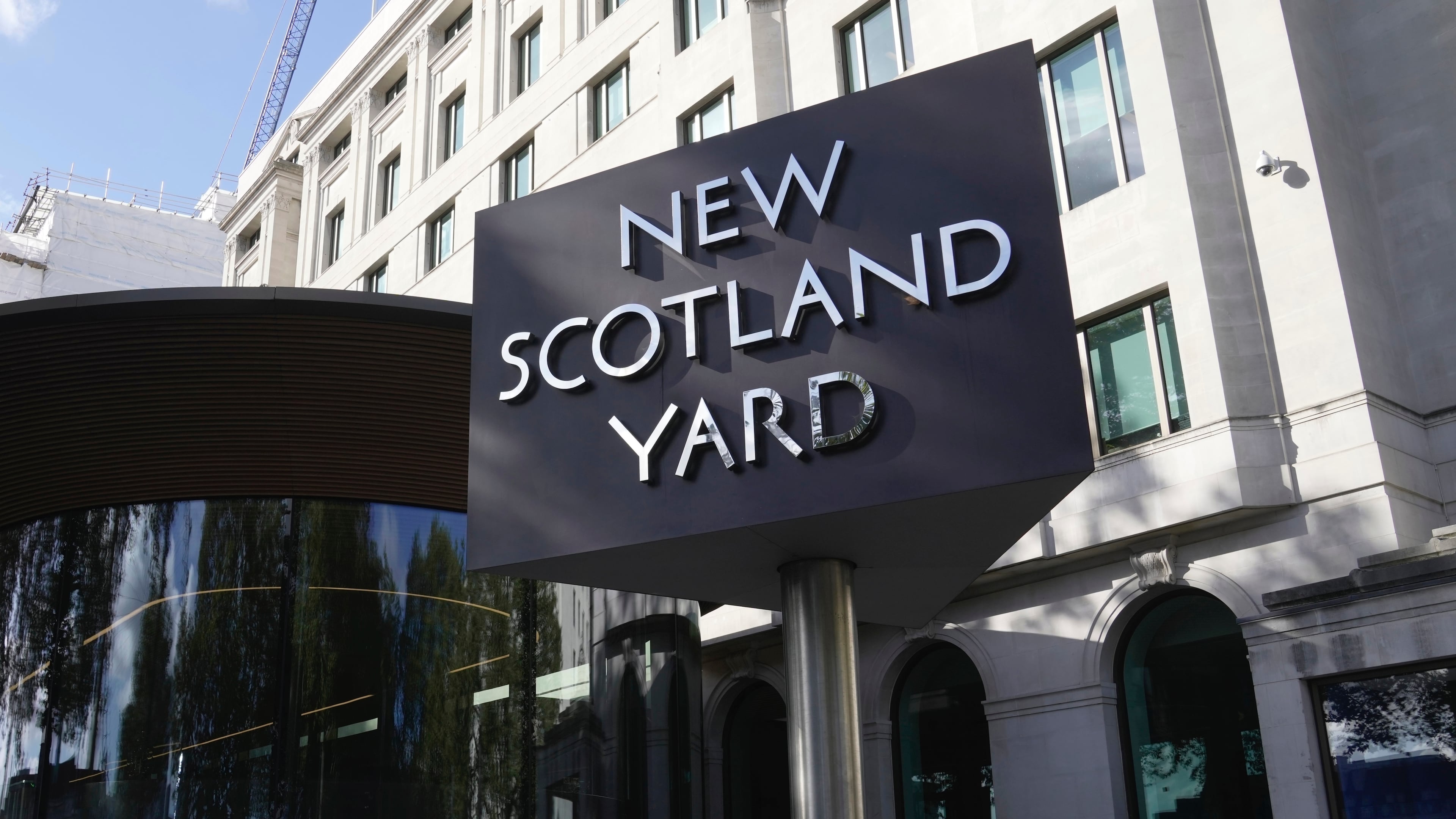 FILE - A sign stands in front of the New Scotland Yard, the headquarters of the London Metropolitan Police, in London, Sept. 25, 2023. (AP Photo/Kin Cheung, File)