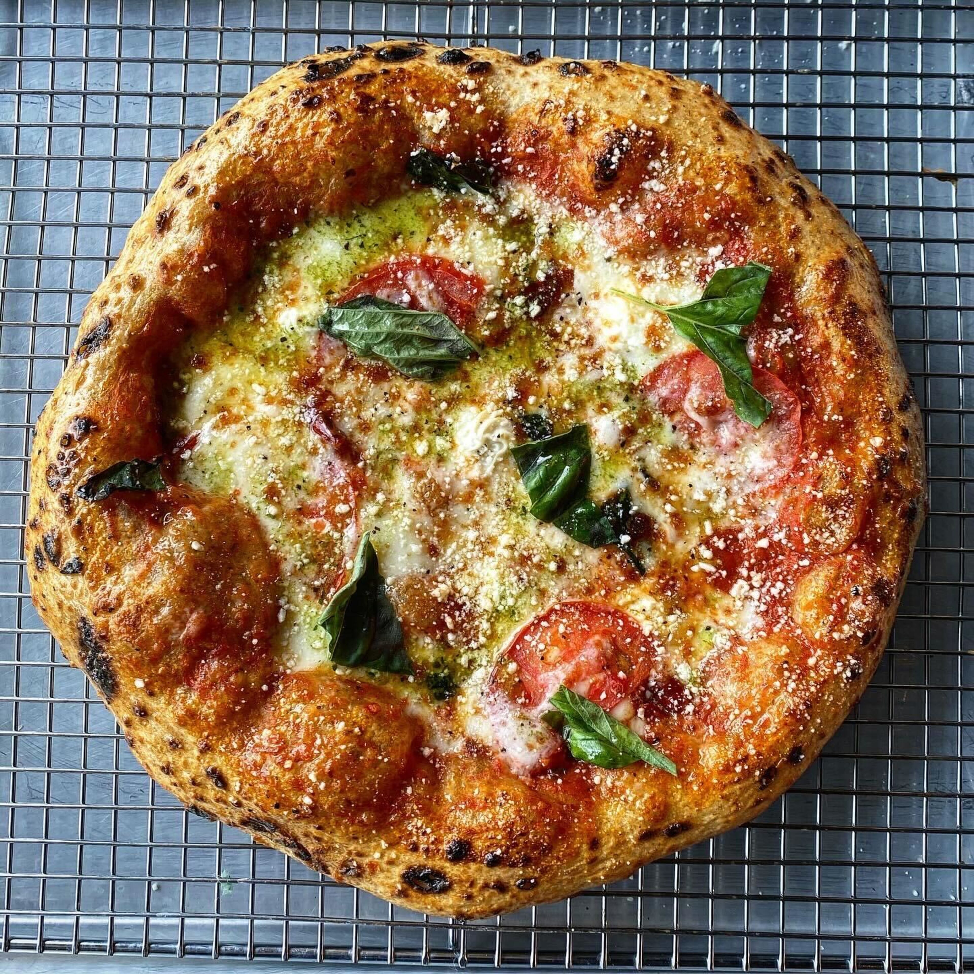 Ghost Pizza dough is made with a proprietary spice blend and beer from local breweries. / Courtesy of Ghost Pizza