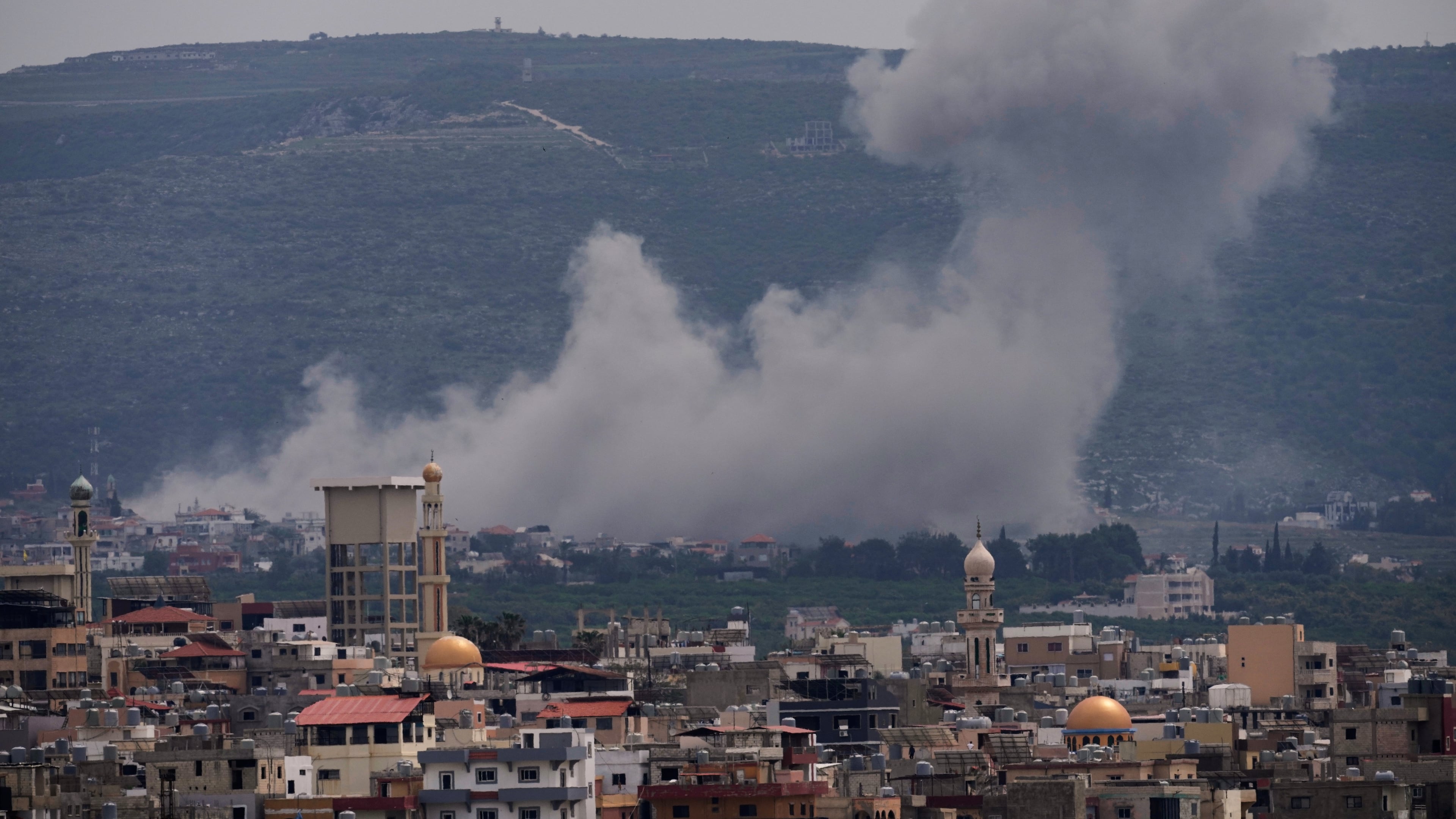 Smoke rises following an Israeli airstrike on the village of Qlaileh, as seen from the southern port city of Tyre, Lebanon, Wednesday, April 15, 2026. (AP Photo/Hussein Malla)
