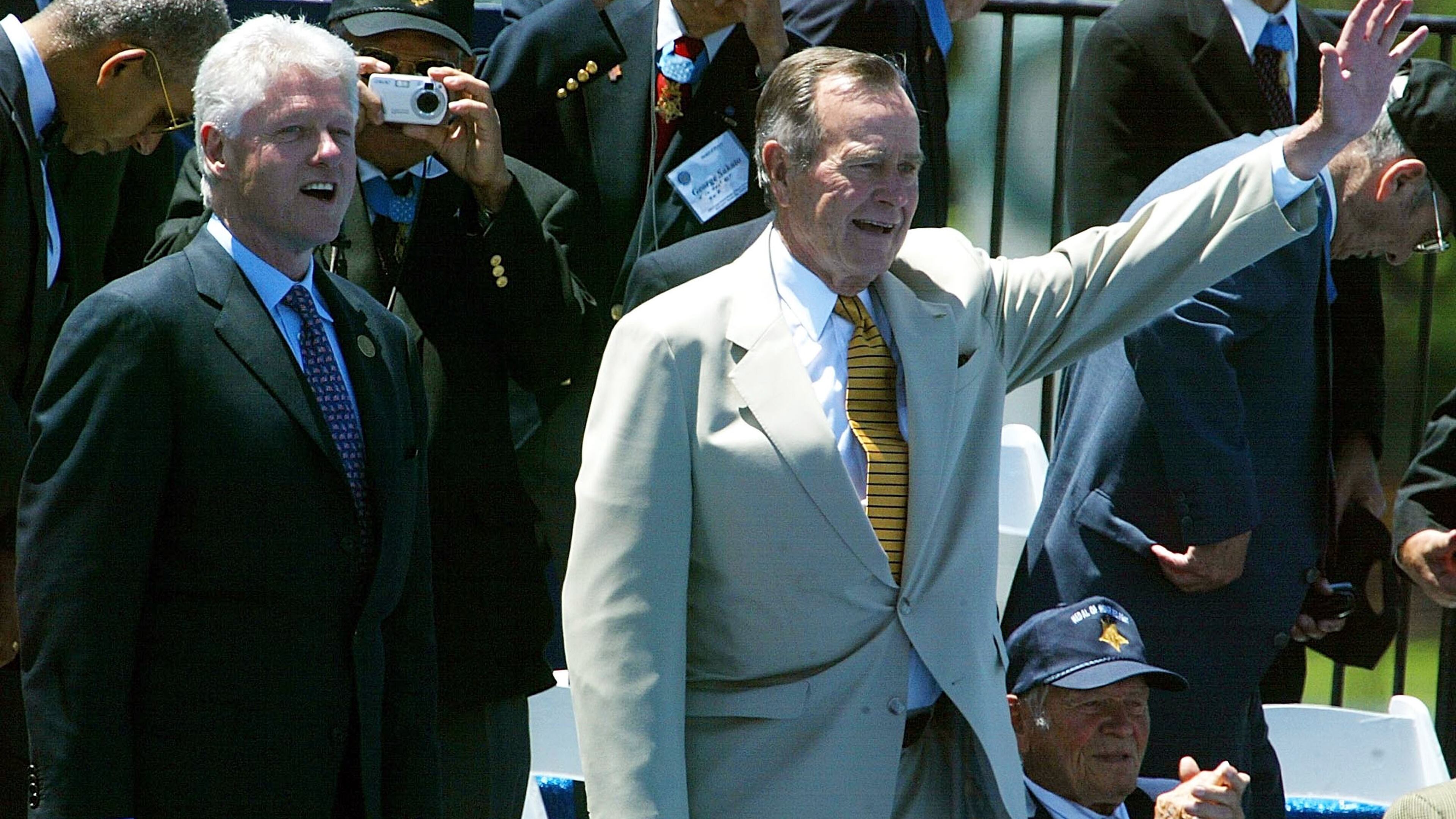 WASHINGTON - MAY 29: Former U.S. presidents George H.W. Bush (R) and Bill Clinton attend the dedication of the World War II Memorial May 29, 2004 in Washington DC. The memorial, completed last month, comes 59 years after the Allies victory in Europe and Japan. (Photo by Mark Wilson/Getty Images)