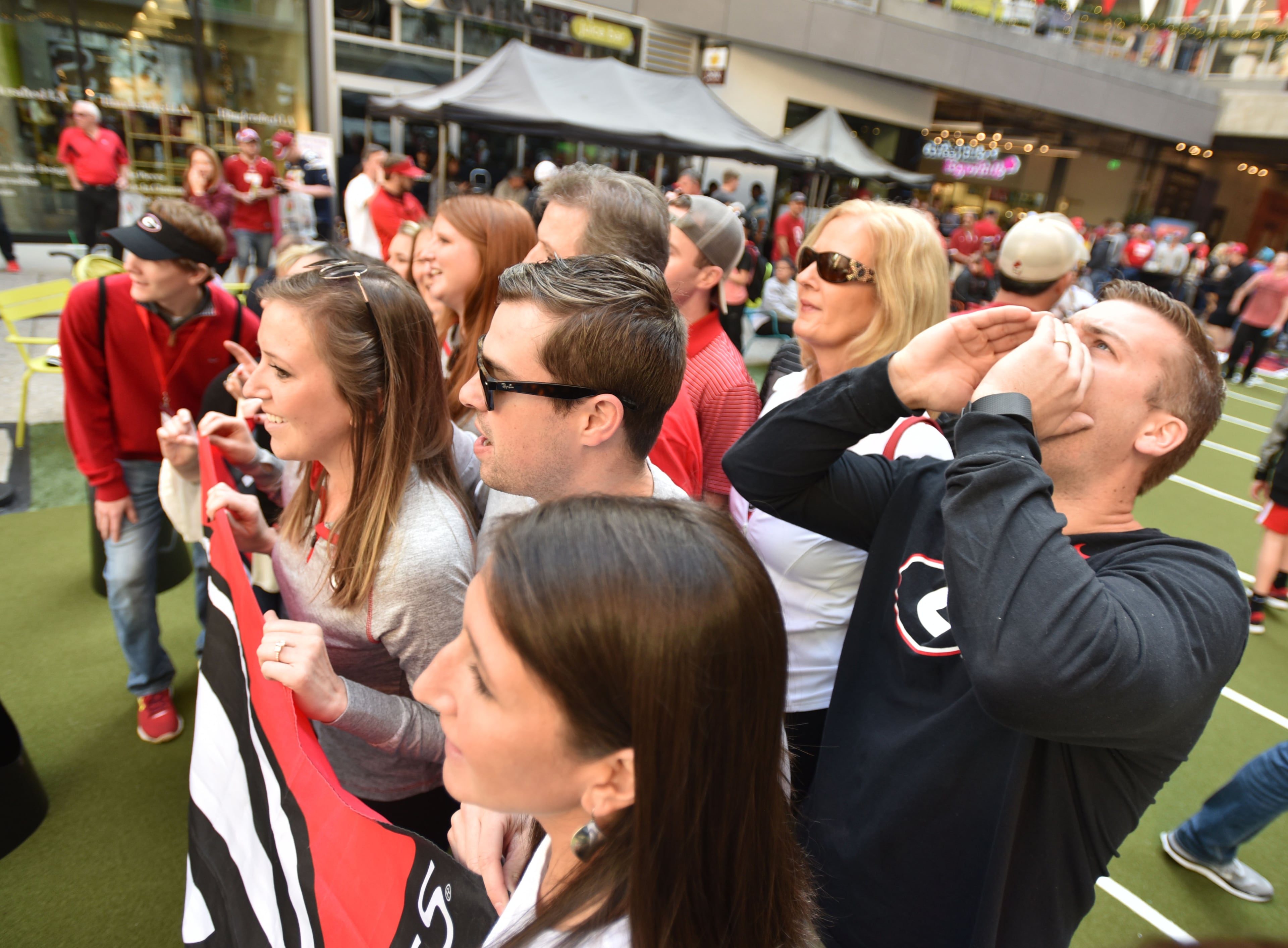 December 31, 2017 Los Angeles, California - Connor Flagel (center), of Marietta, plays a game of corn hole during the Rose Bowl Bash in downtown Los Angeles on Sunday, December 31, 2017. Hyosub Shin / hshin@ajc.com