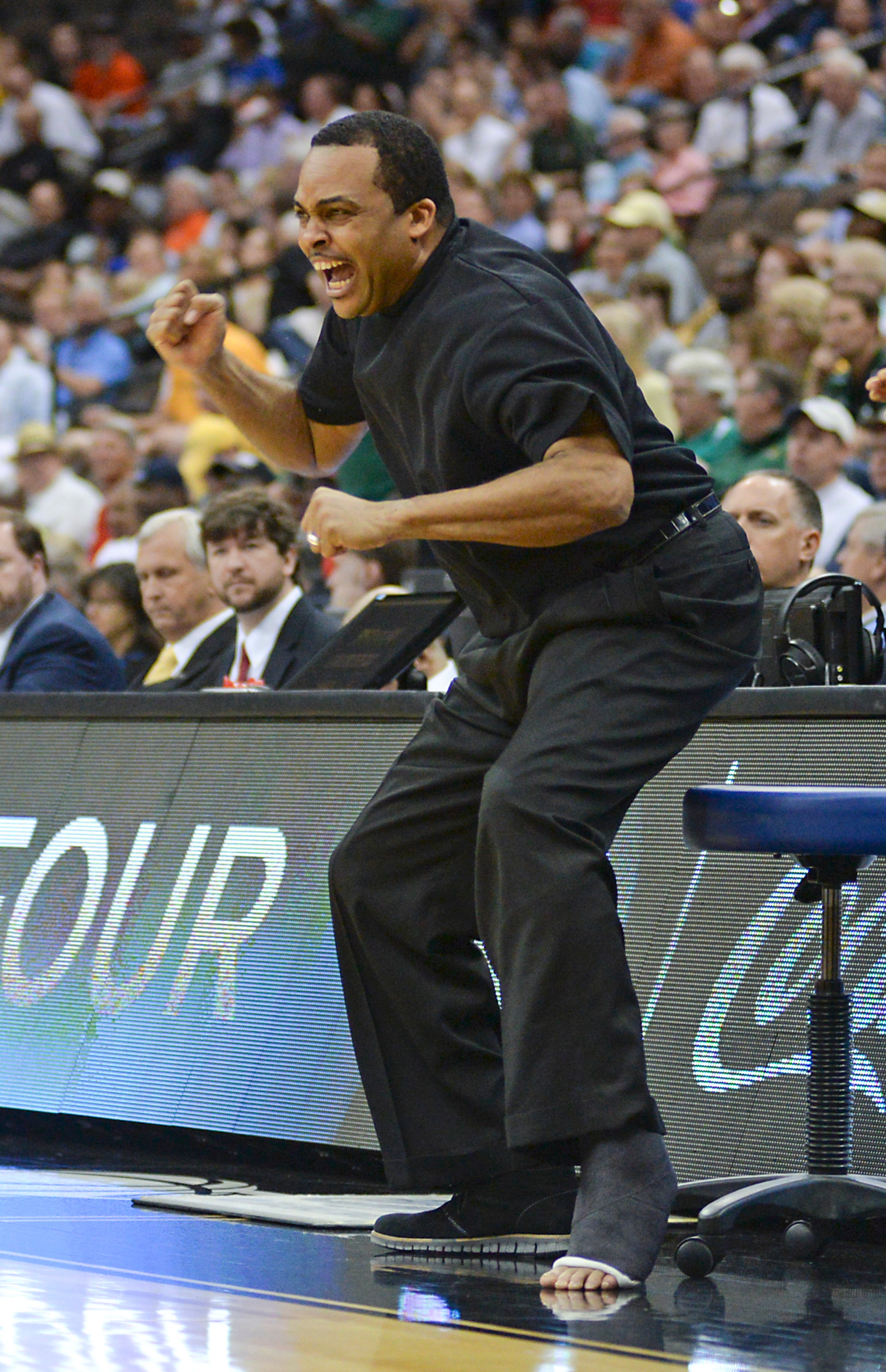 Ron Hunter cheers for his players during the second half Thursday. (AP Photo/Rick Wilson)
