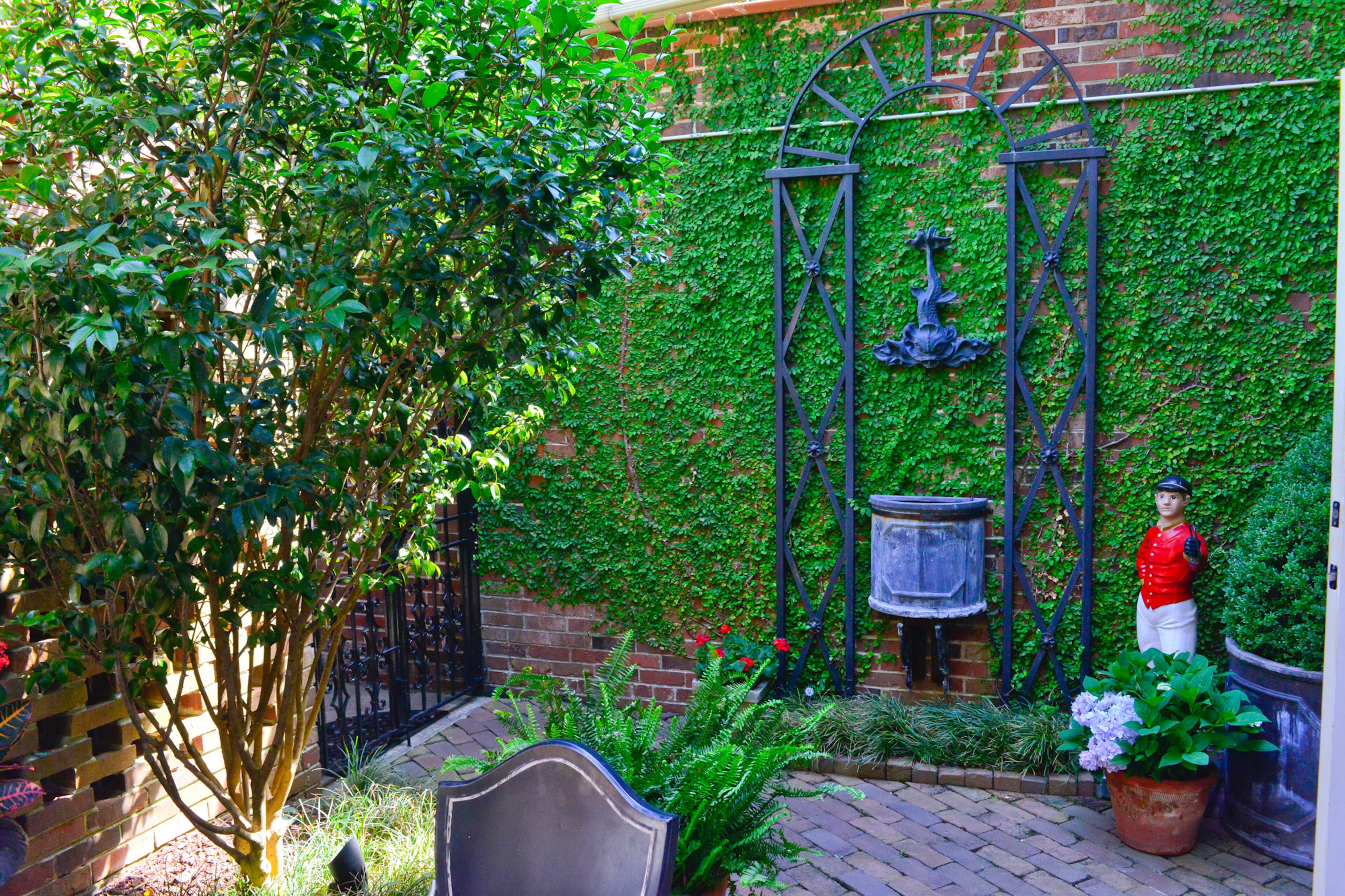Much of the decor in the courtyard, like the water feature and trellis, existed when Rice and Mock bought the house.