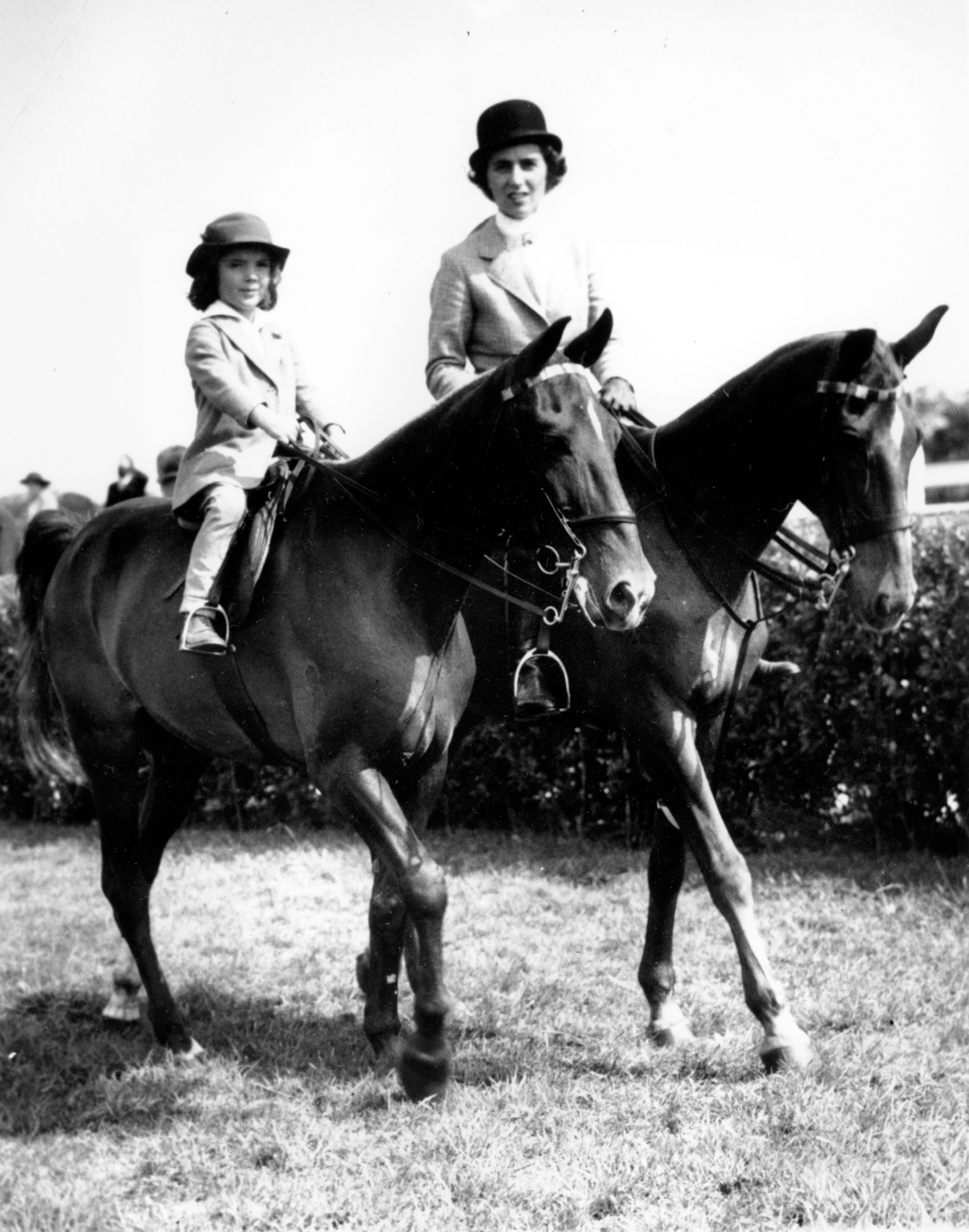 A young Jacqueline Bouvier, shown with her mother Janet Lee Bouvier, wins third prize in the family class at the East Hampton Horse Show on New York's Long Island. (AP Photo)