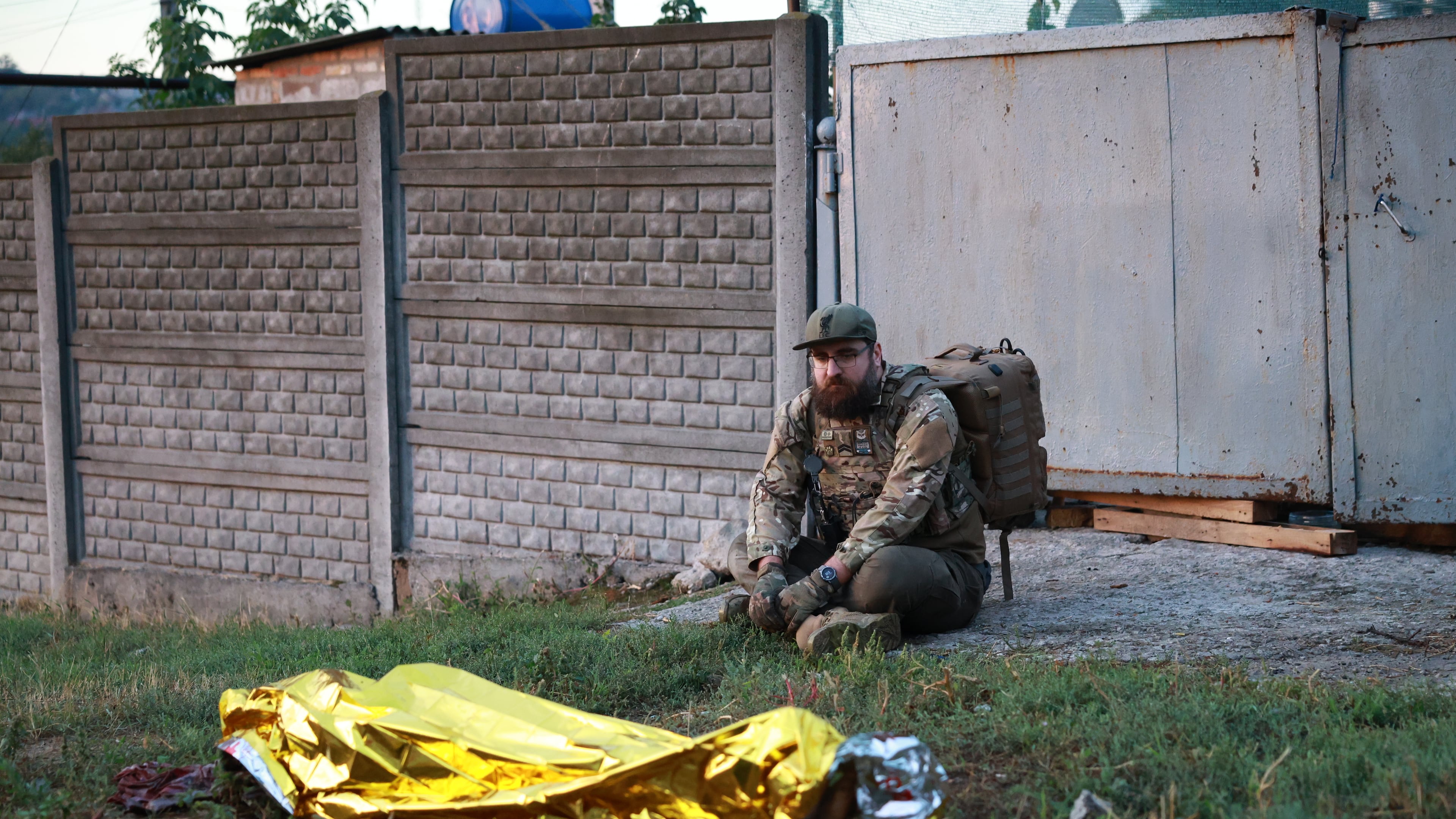 A paramedic looks at the body of a woman killed in a Russian strike on residential neighbourhood on Zaporizhzhia, Ukraine, on Saturday, Sept.26, 2026. (AP Photo/Kateryna Klochko)