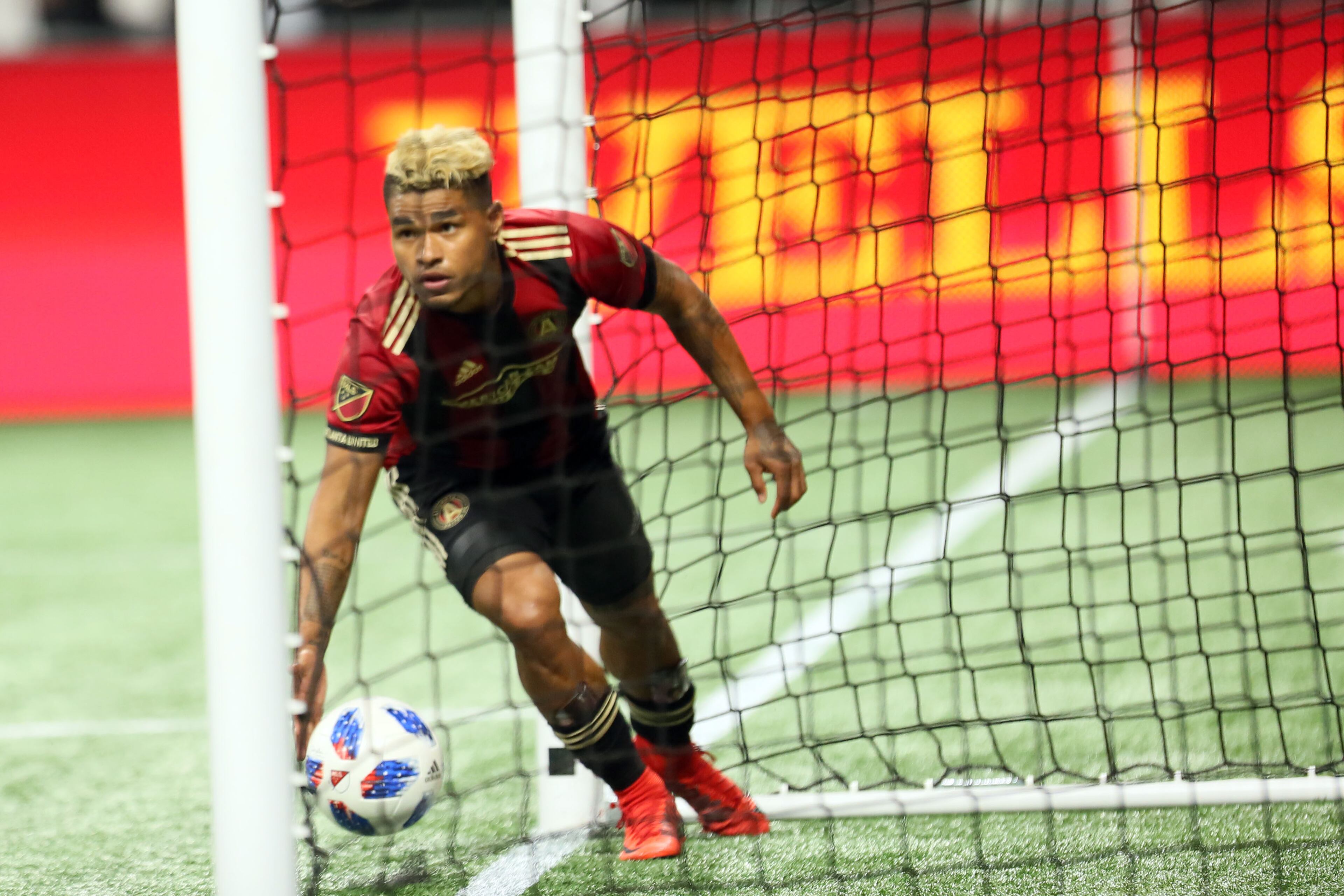 March 11, 2018. Atlanta United forward Josef Martinez #7 pics up the ball inside the goal after scoring the first goal of the team on March 11, 2018 in Atlanta Ga..
