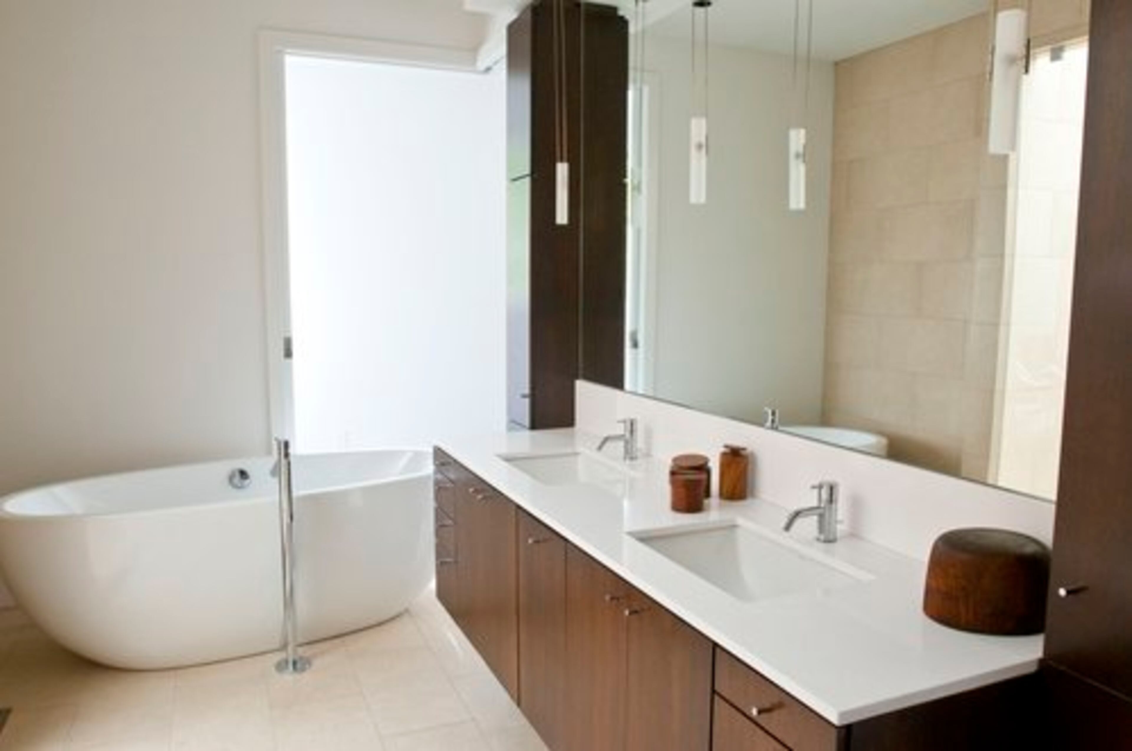 The free-standing tub in the master bedroom is by Americh, which was made at the company's North Carolina factory.