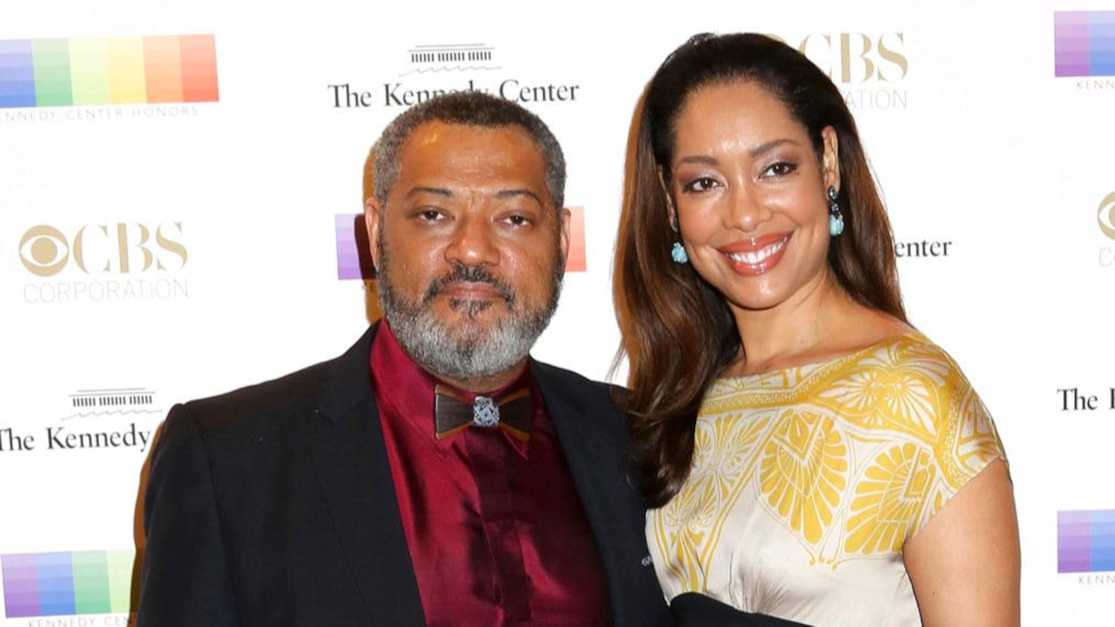 FILE - In this Dec. 6, 2015 file photo, Laurence Fishburne, left, and Gina Torres attend the 38th Annual Kennedy Center Honors at The Kennedy Center Hall of States in Washington. Court records in Los Angeles show that Fishburne filed for divorce from his wife of 15 years, Torres, on Thursday, Nov. 2, 2017, and is seeking joint custody of their 10-year-old daughter.
