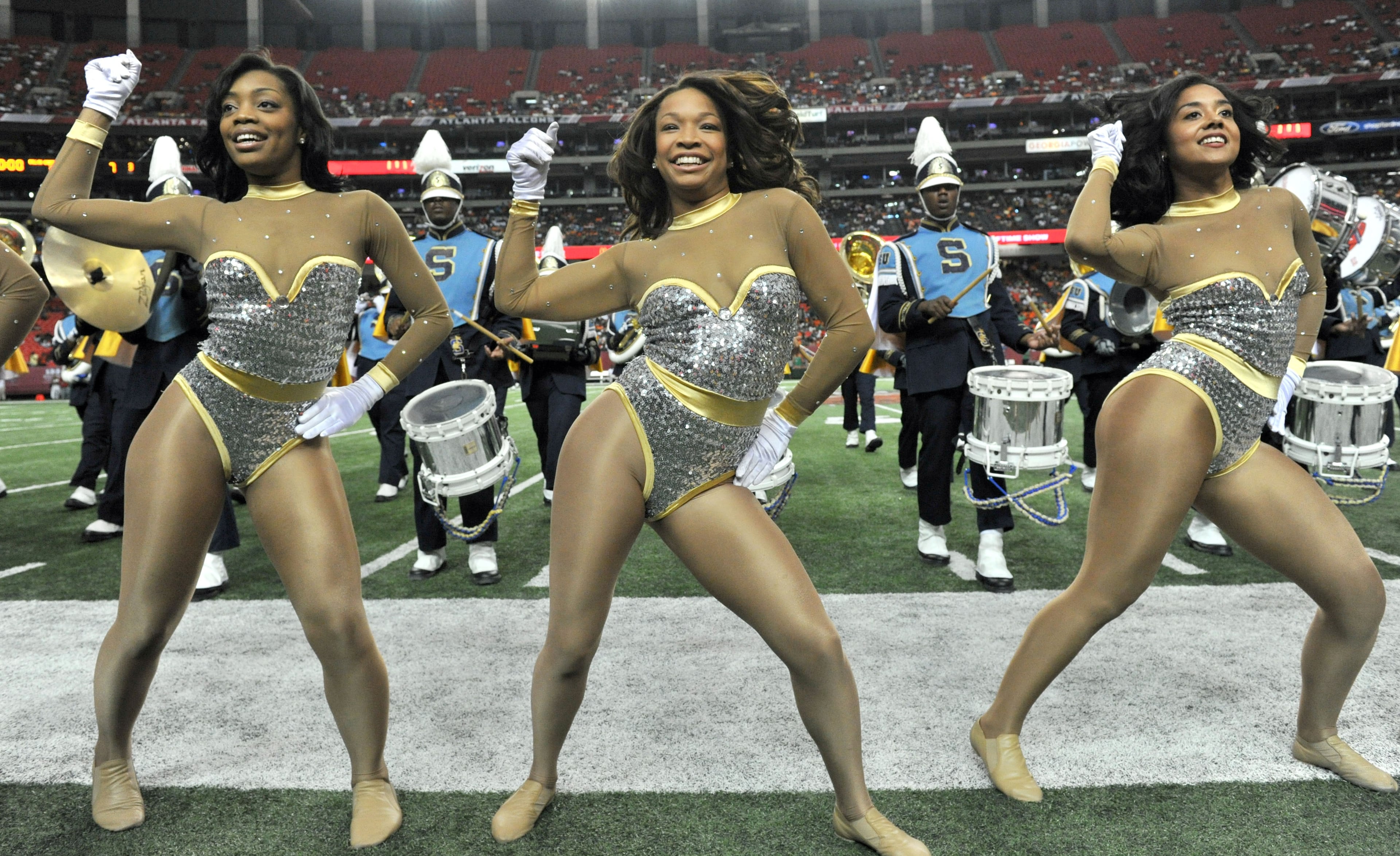 The Southern University Dancing Dolls perform with the marching band at halftime of the 2012 Bank of America Atlanta Football Classic.