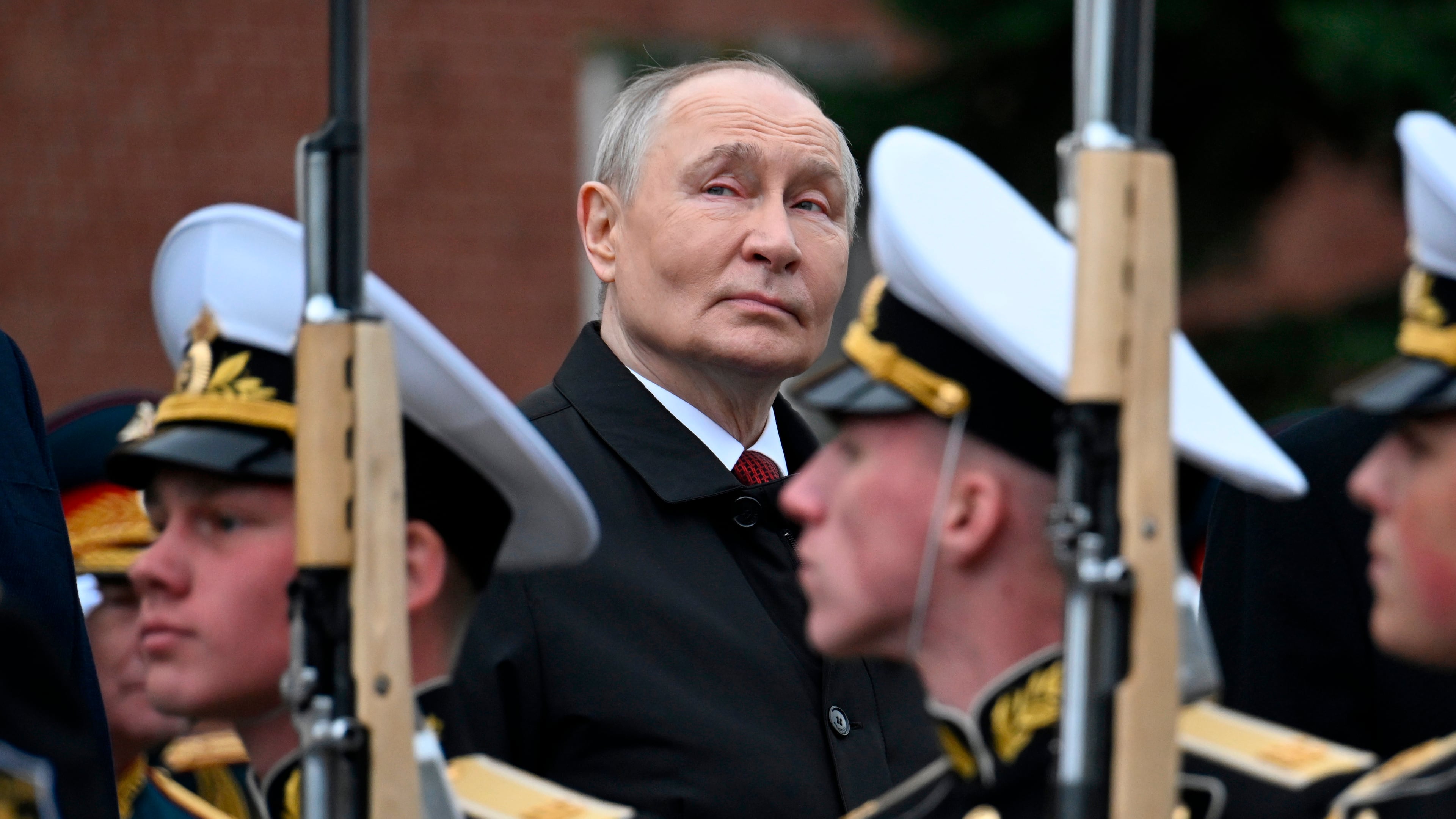 Russian President Vladimir Putin, centre foreground, attends a ceremony to lay flowers at the Tomb of the Unknown Soldier by the Kremlin wall inMoscow, Saturday, May 9, 2026, during celebrations of the 81st anniversary of the Soviet Union's victory over Nazi Germany during the World War II. (Alexander Nemenov/Pool Photo via AP)