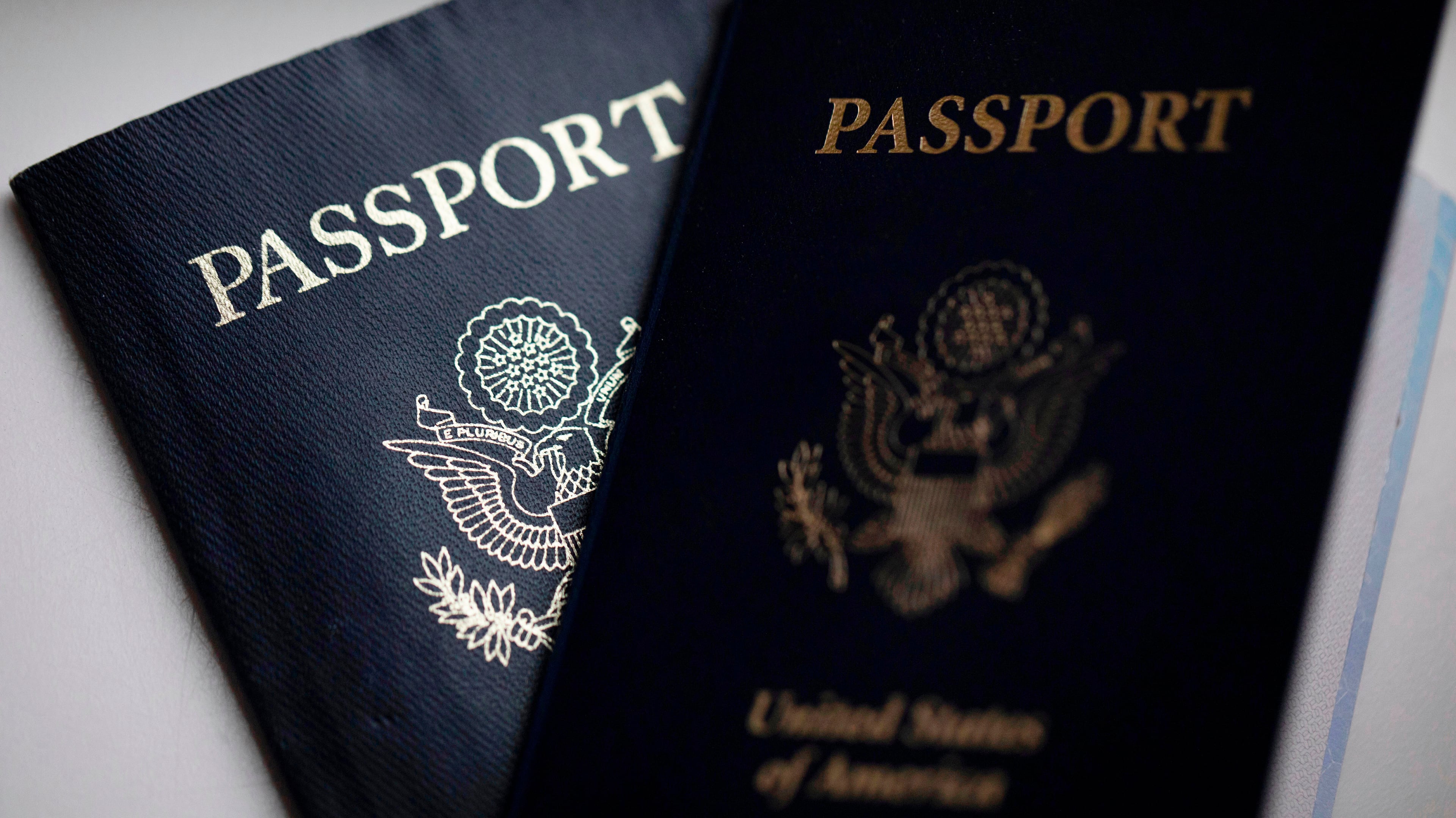 FILE - U.S. passports are arranged for a photograph in Tigard, Ore., Dec. 11, 2021. (AP Photo/Jenny Kane, File)
