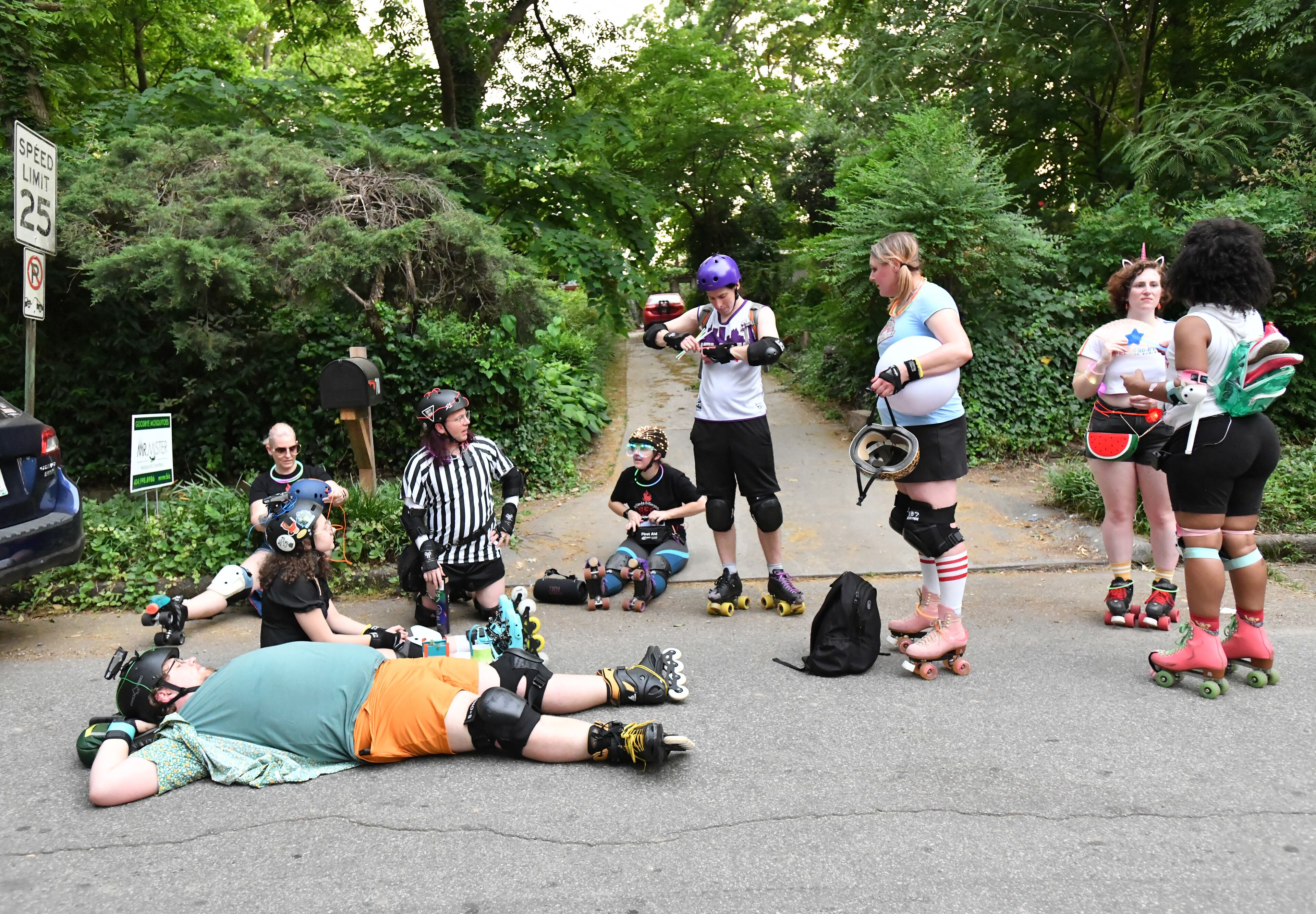 Participants rest before the start of the 12th Atlanta Beltline Lantern Parade on Saturday, May 21, 2022. (Hyosub Shin / Hyosub.Shin@ajc.com)