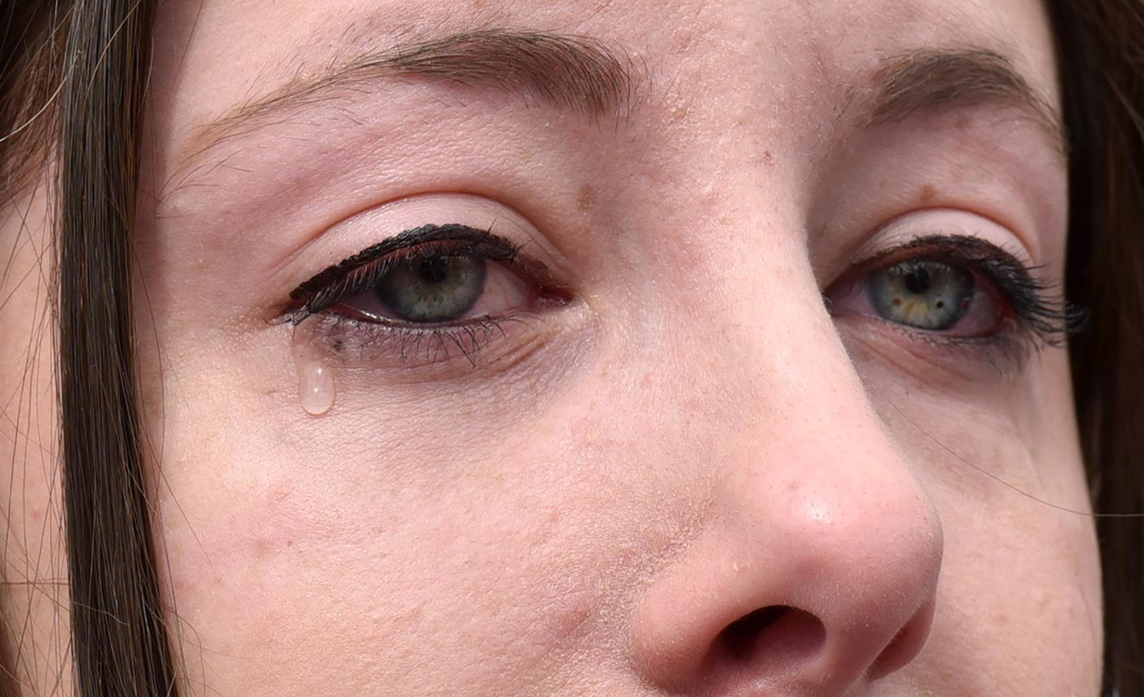 March 24, 2018 Atlanta - A protester cries during moment of silence with survivors at the Center for Civil and Human Rights before walking to Liberty Plaza on Saturday, March 24, 2018. Atlanta police estimated the crowd at near 30,000 for todayâÃôs March for Our Lives. People of all ages were drawn to one of the nationwide demonstrations in a movement begun by student survivors of last monthâÃôs mass killing in a Parkland, Fla., school. Some of those Florida students were among the speakers in Atlanta. HYOSUB SHIN / HSHIN@AJC.COM