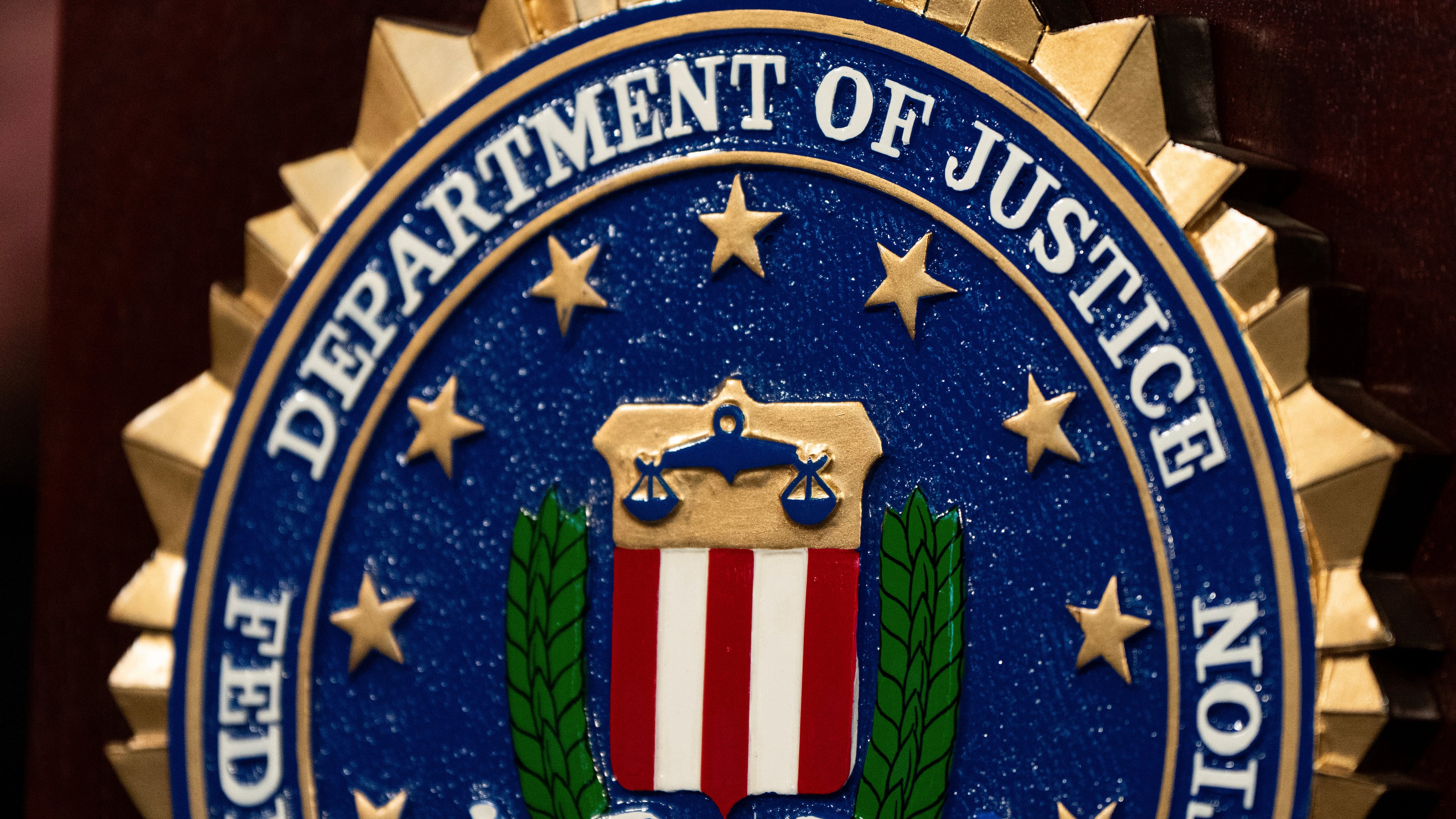 FILE - An FBI seal is displayed on a podium before a news conference at the field office in Portland, Ore., Thursday, Jan. 16, 2025. (AP Photo/Jenny Kane, File)