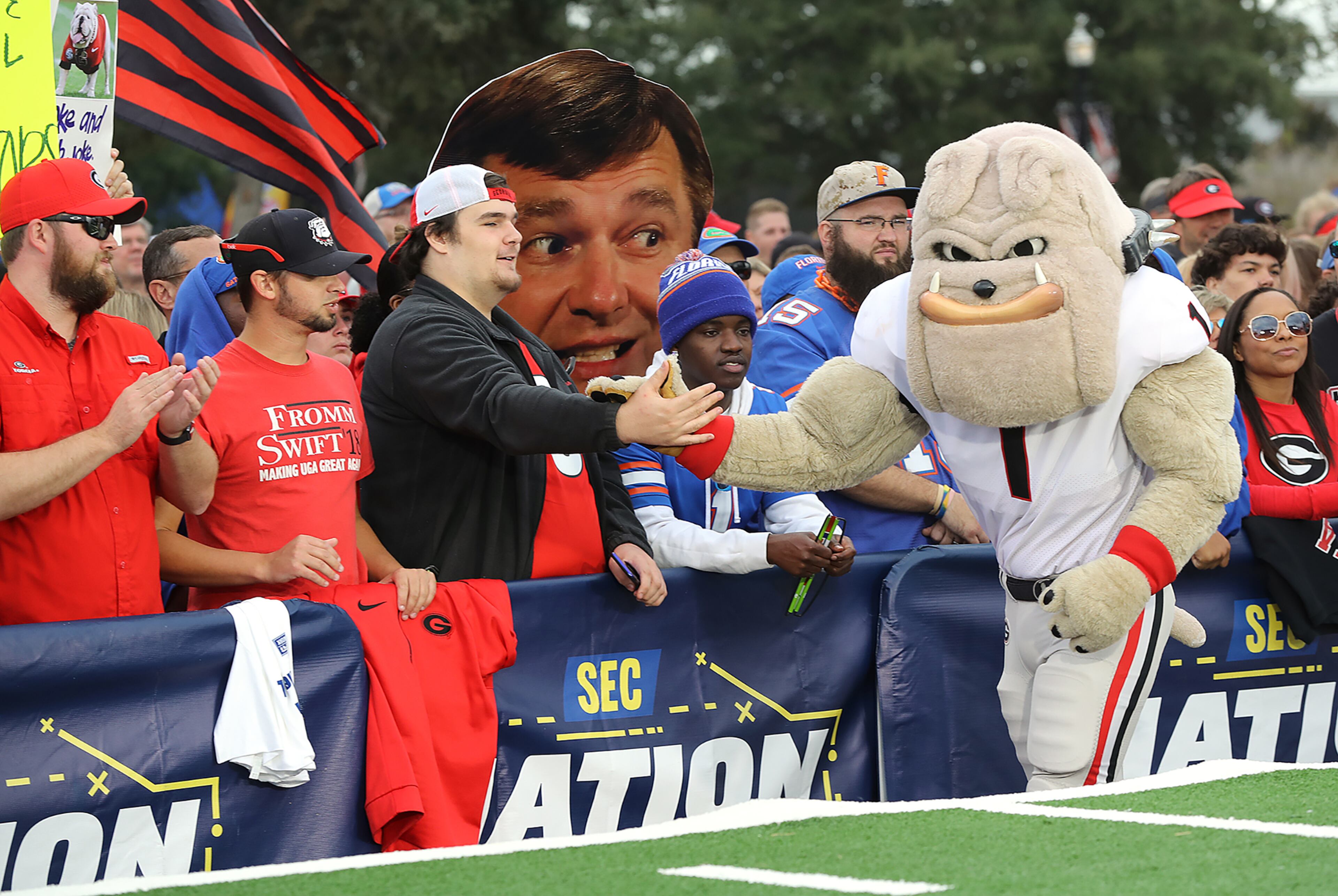Hairy Dawg gives Georgia fans five outside TIAA Bank Field during a rally before the Georgia-Florida game on Saturday, November 2, 2019, in Jacksonville. Curtis Compton/ccompton@ajc.com