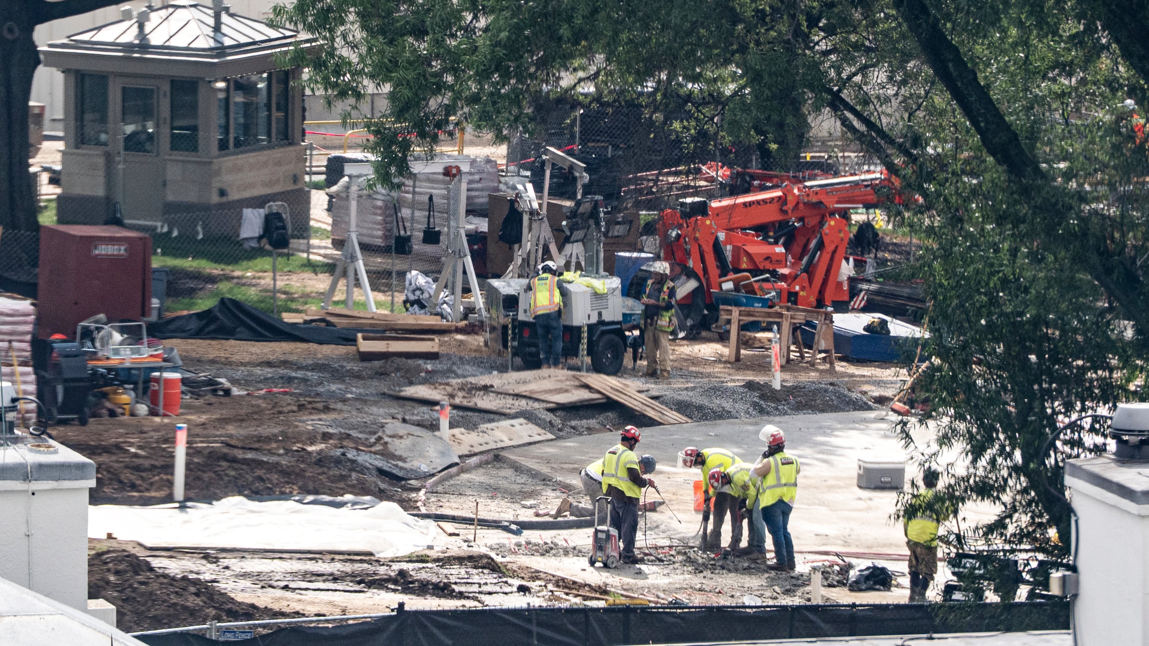 Workers use a jackhammer on the helipad on the South Lawn of the White House, Wednesday, Aug. 5, 2026, in Washington. (AP Photo/Alex Brandon)