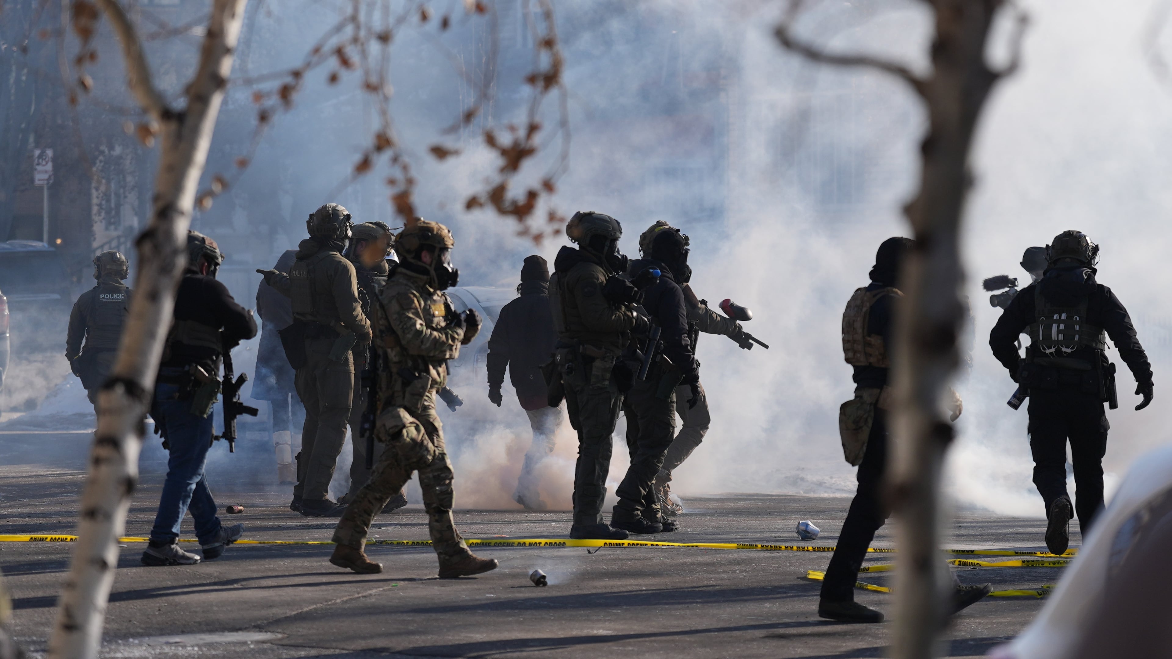 FILE - Federal immigration officers deploy tear gas at protesters after a shooting Jan. 24, 2026, in Minneapolis. (AP Photo/Abbie Parr, File)