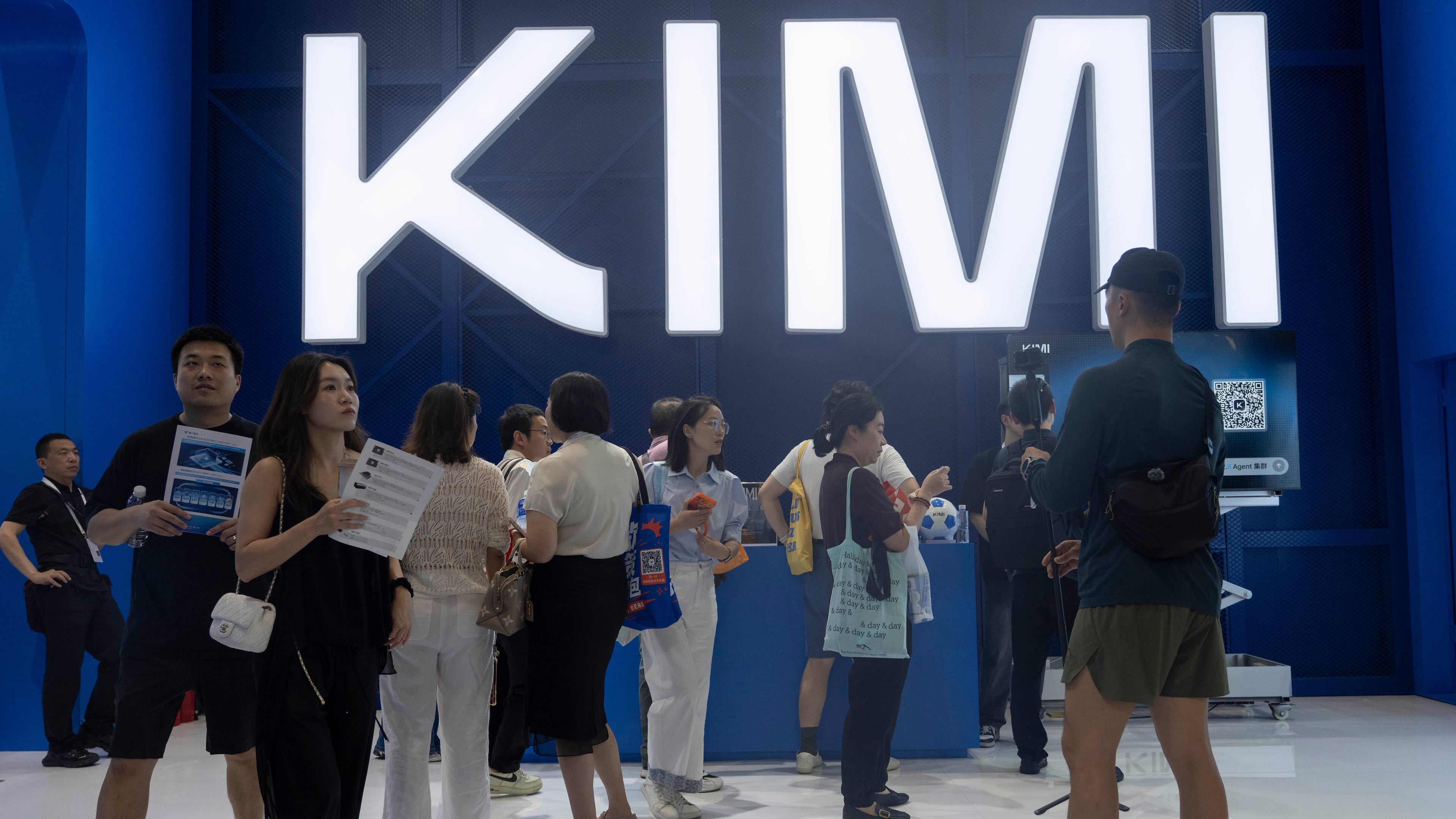 Visitors at the booth for Moonshot's Kimi K3 during World AI Conference in Shanghai, Friday, July 17, 2026. (AP Photo/Ng Han Guan)